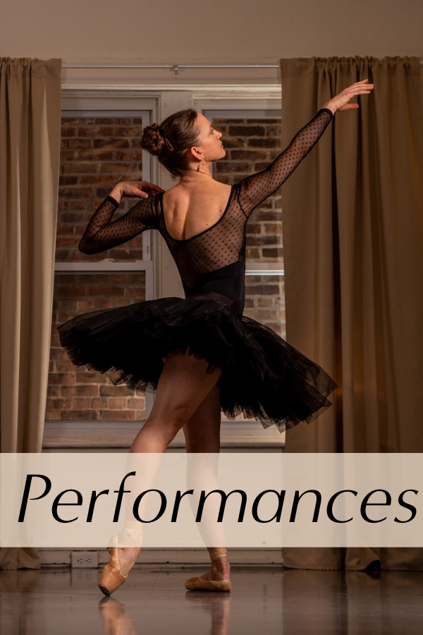 A dancer in a black tutu shows a tendu derriere in front of the evening windows at Northeast Arts.