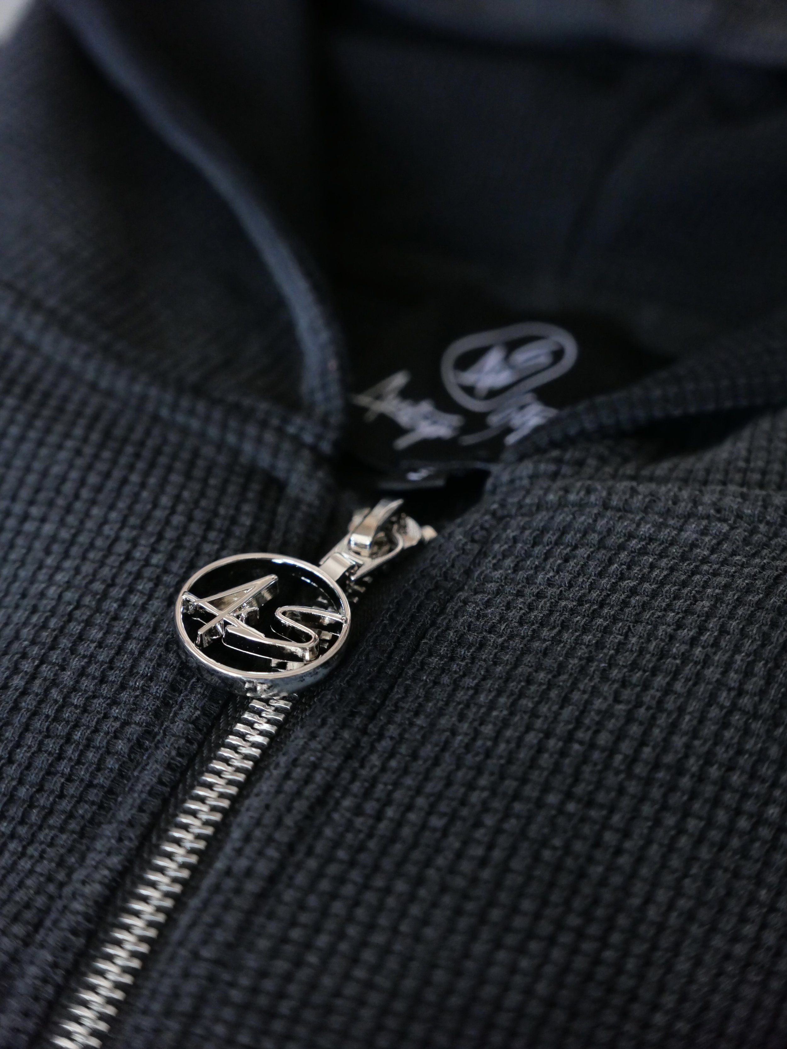 close detailed shot of light weight waffle knit zip up.jpeg