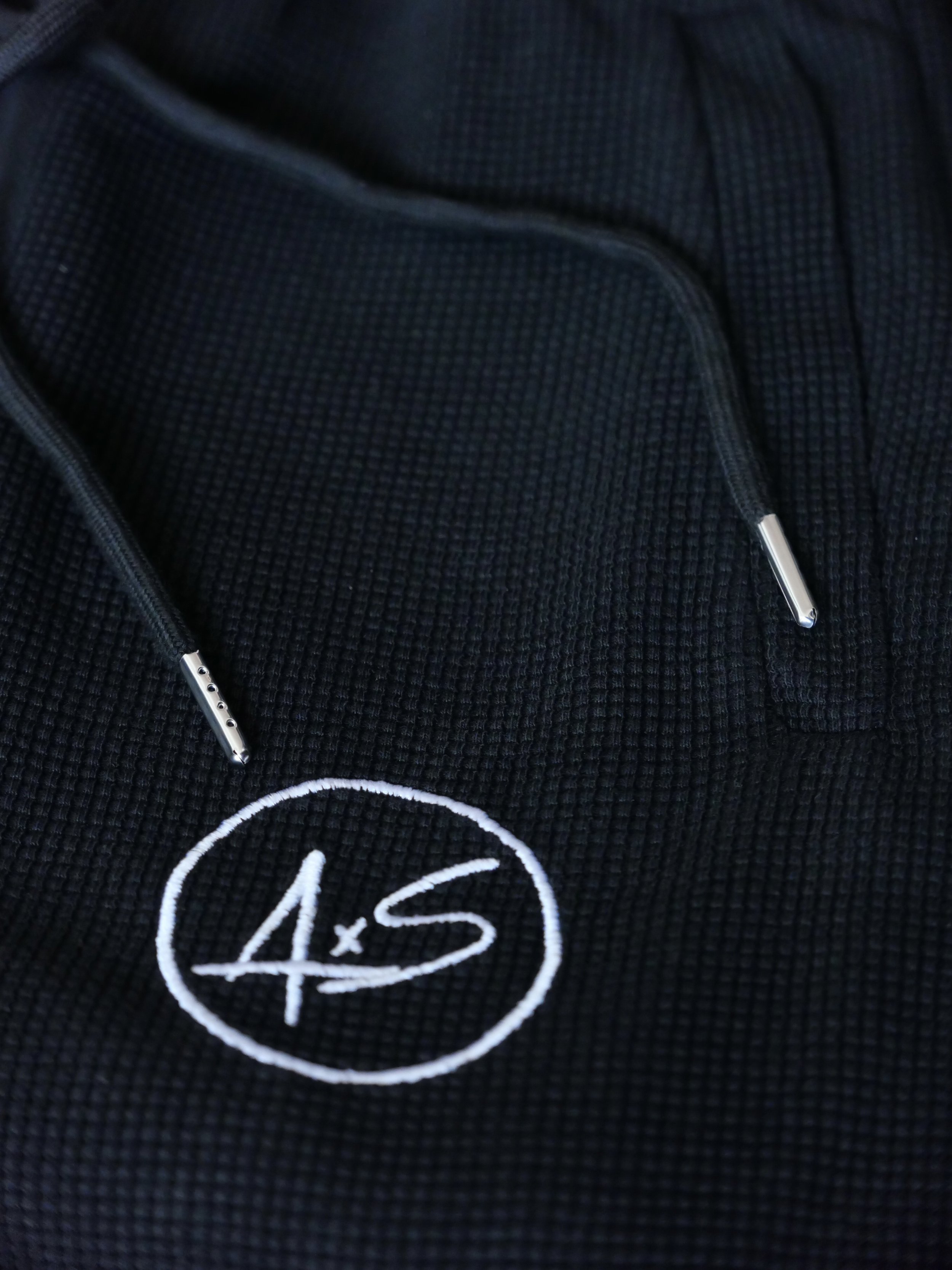 close detailed shot of light weight waffle knit sweat pants.jpeg