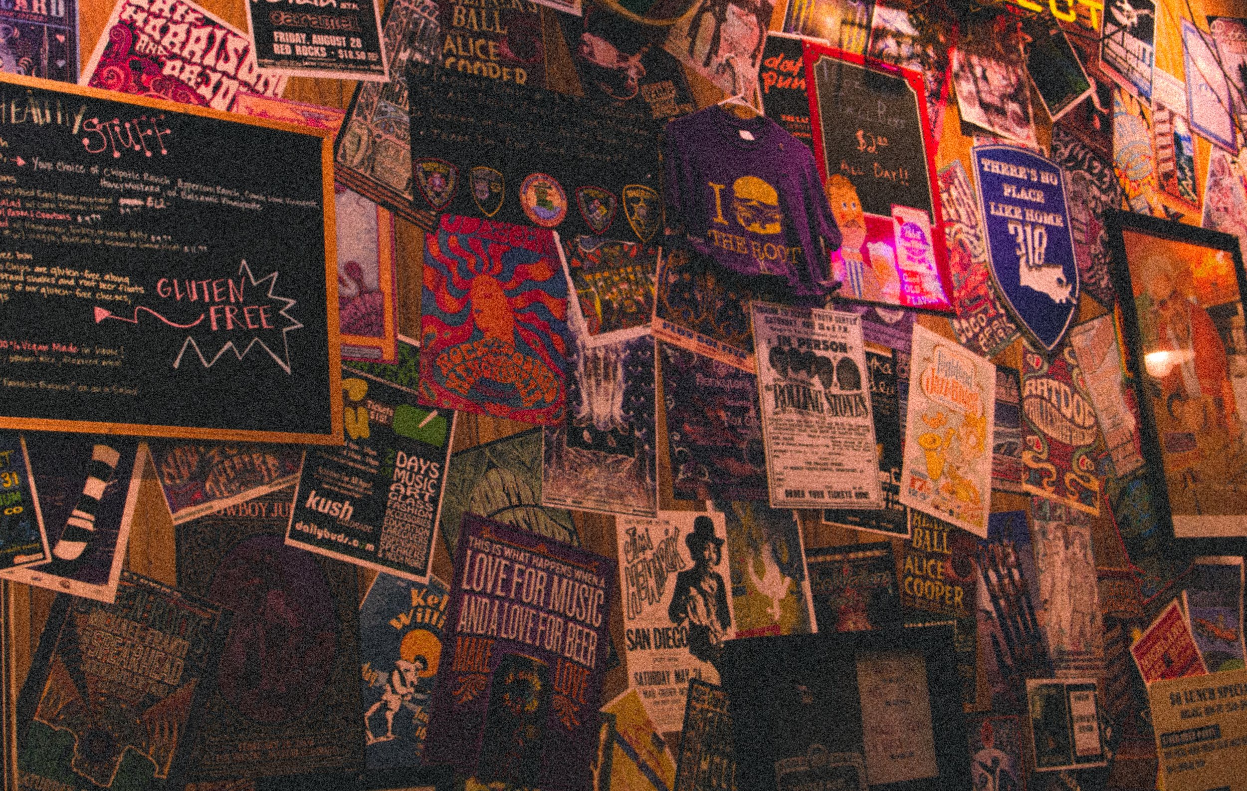 Artistic photograph of restaurant’s colorful bulletin board displaying numerous flyers.