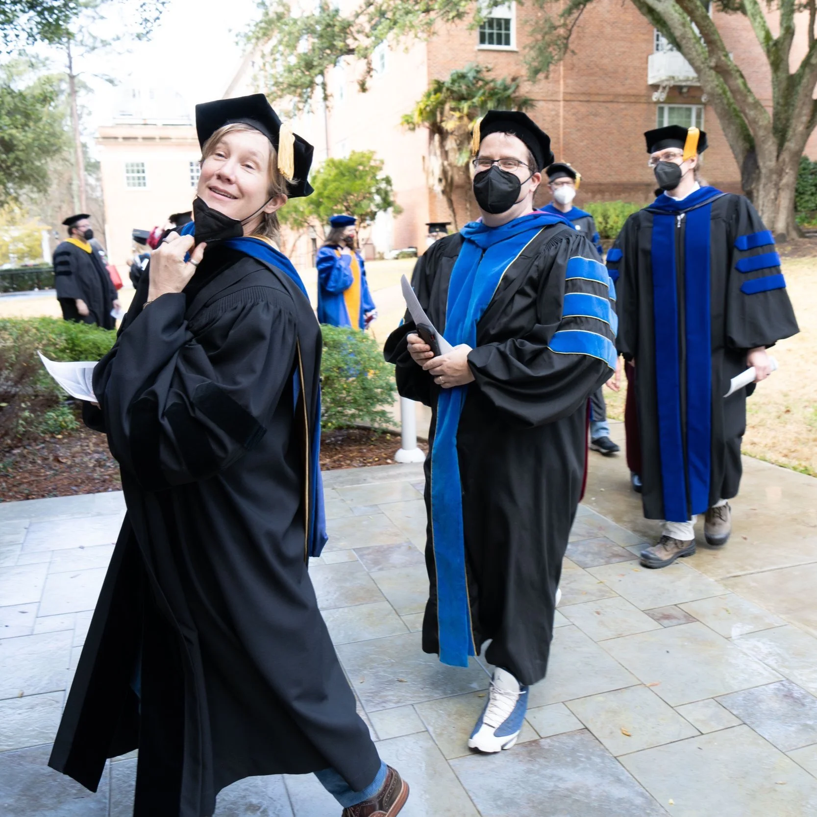 Photograph of Dr. Hamming and other faculty proceeding in.