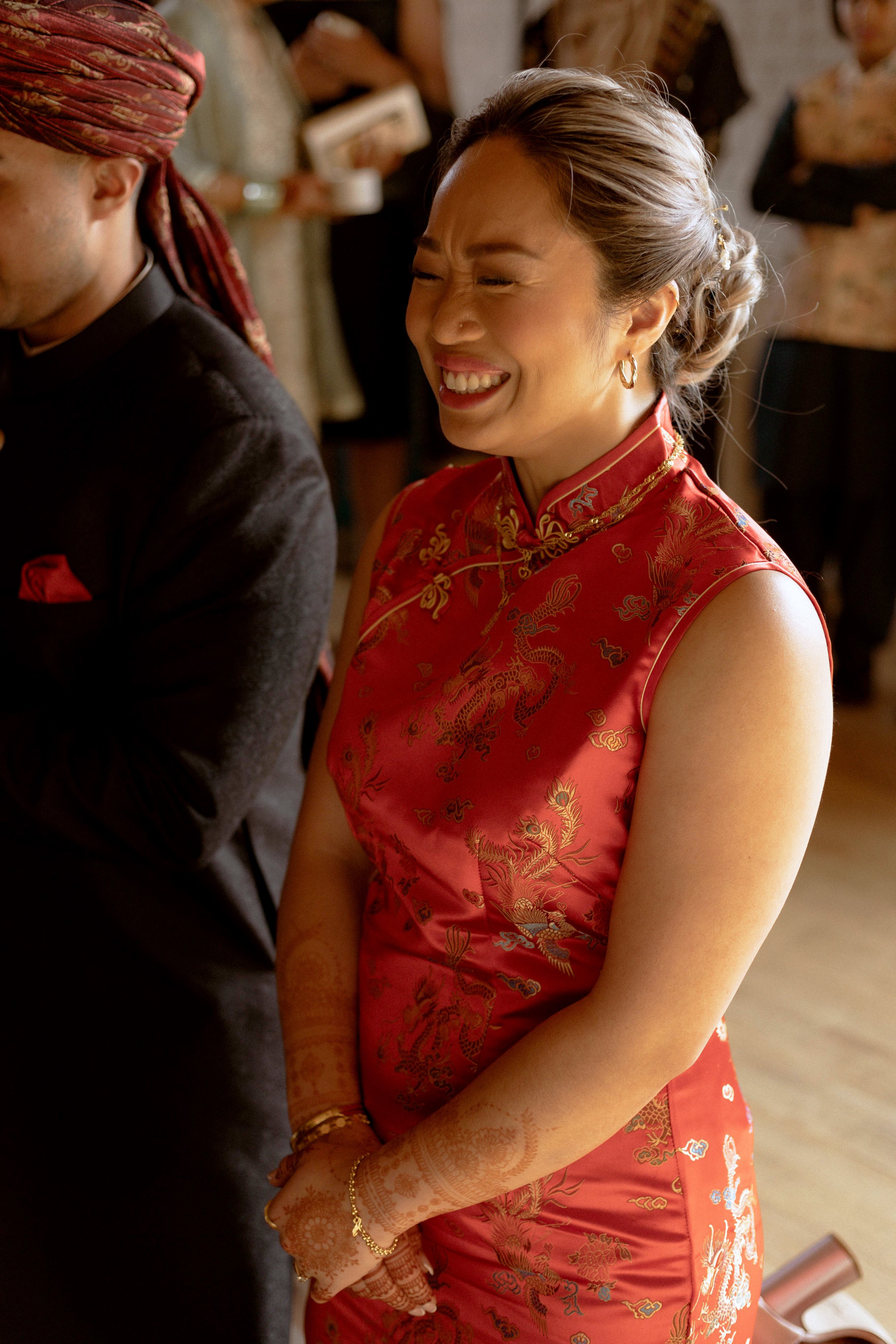 bride laughing and smiling during wedding ceremony