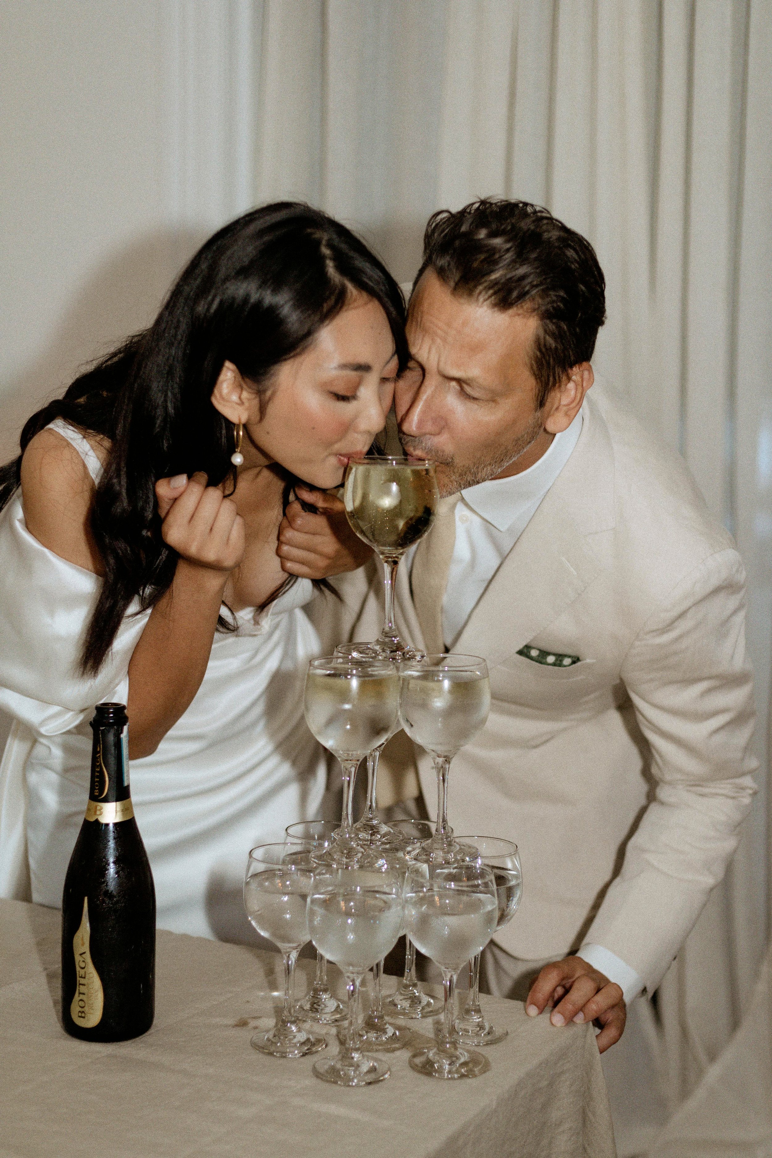 bride and groom sipping on champagne during their elopement in Toronto