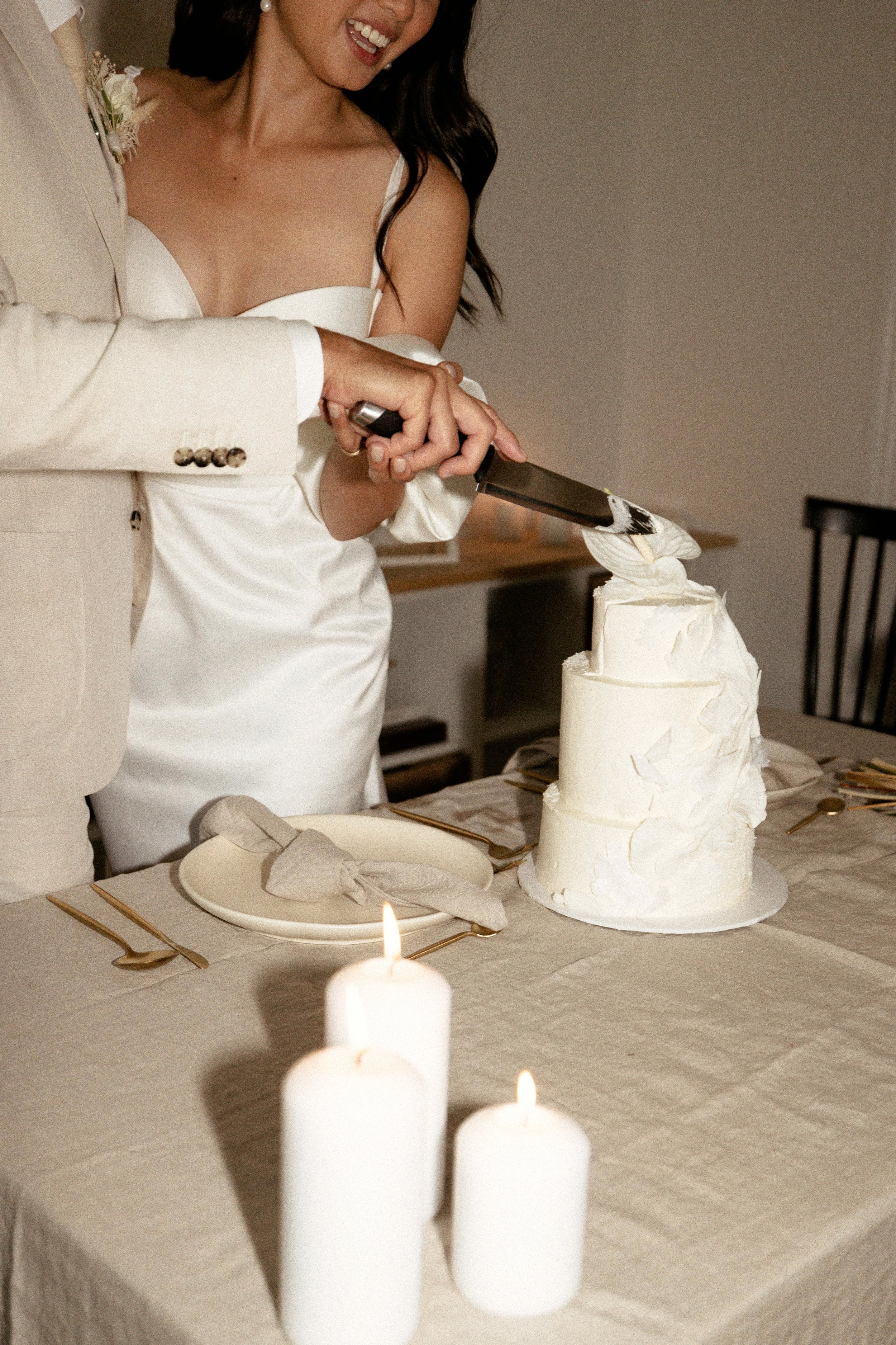 bride and groom celebrating their elopement - cake cutting ceremony 