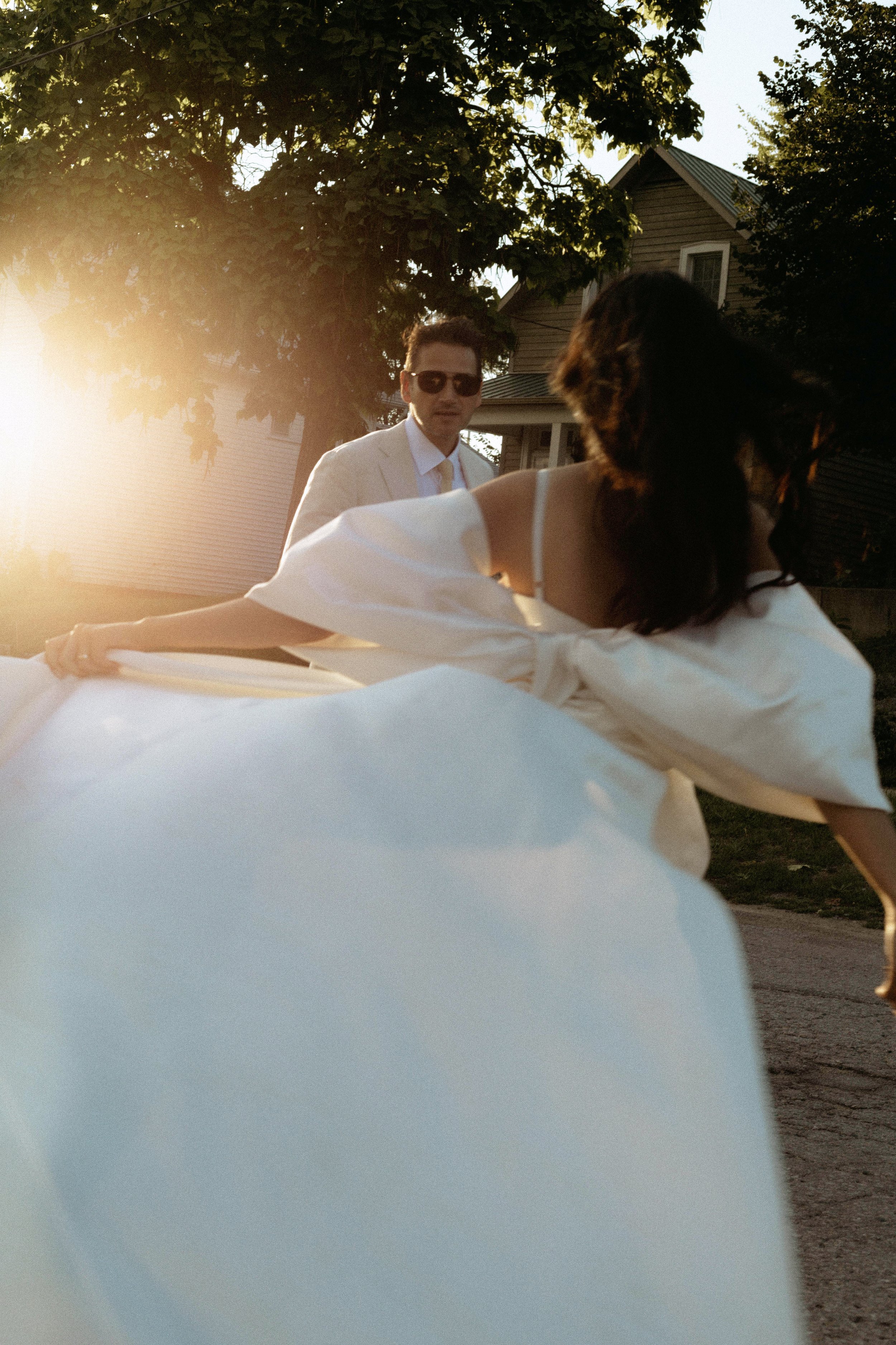 bride and groom dancing in the sunlight during sunset for their elopement photos