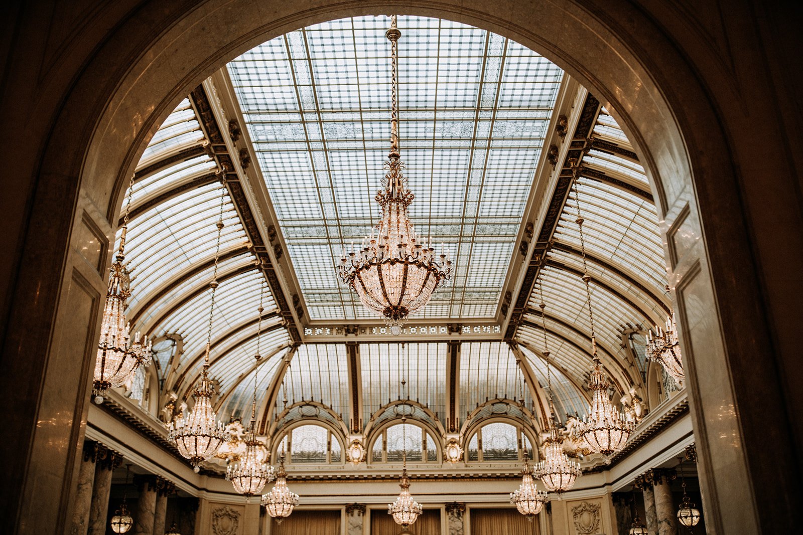  ceiling of grand architecture with chandeliers  