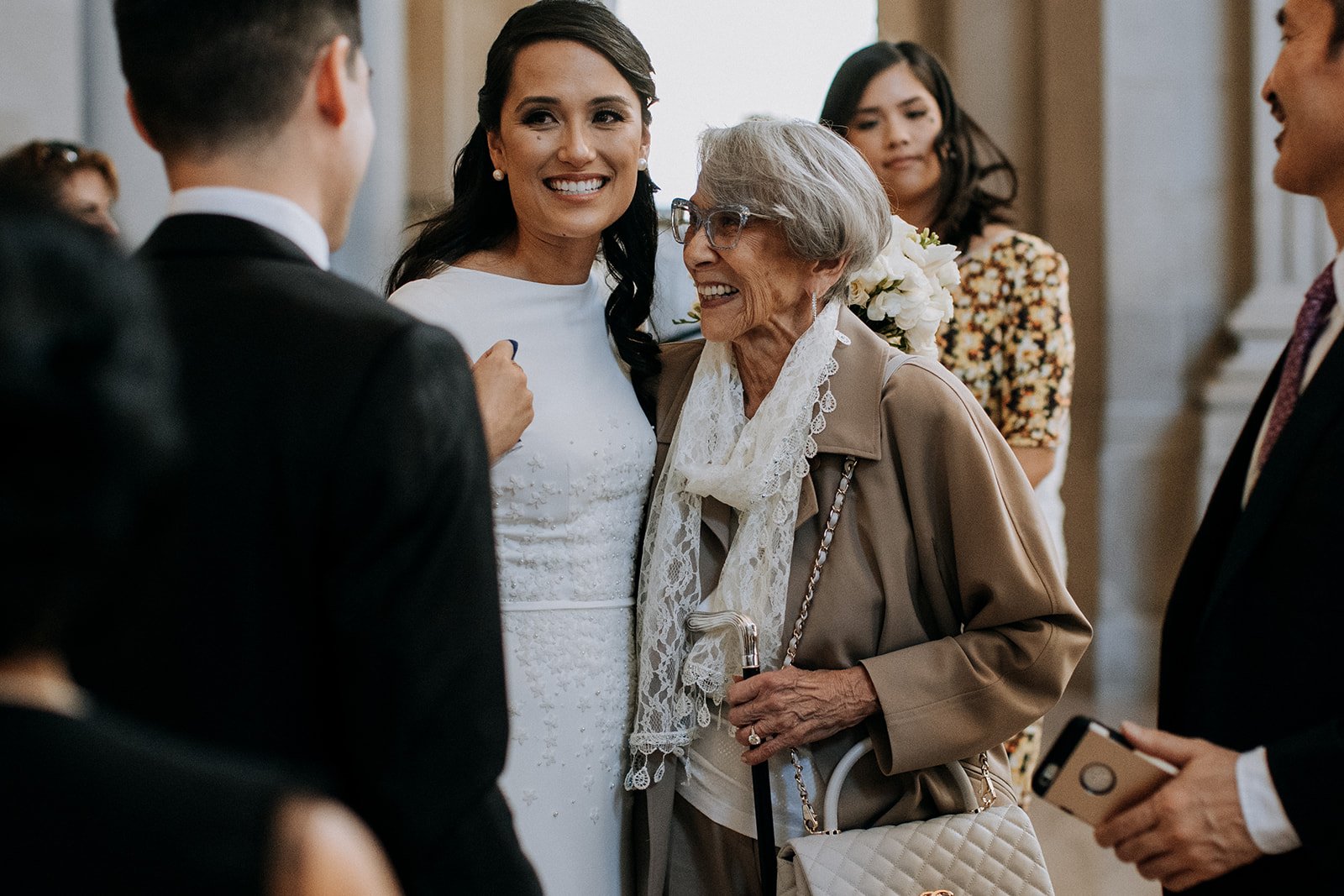  bride smiling with elderly woman  