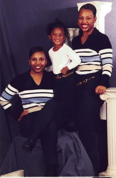 My two older sisters and me (in the middle in white). 