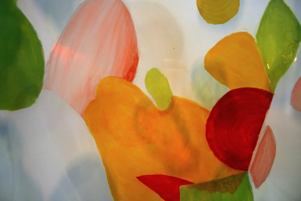 Abstract watercolor painting with shapes and colors including green, red, yellow, pink, and orange.