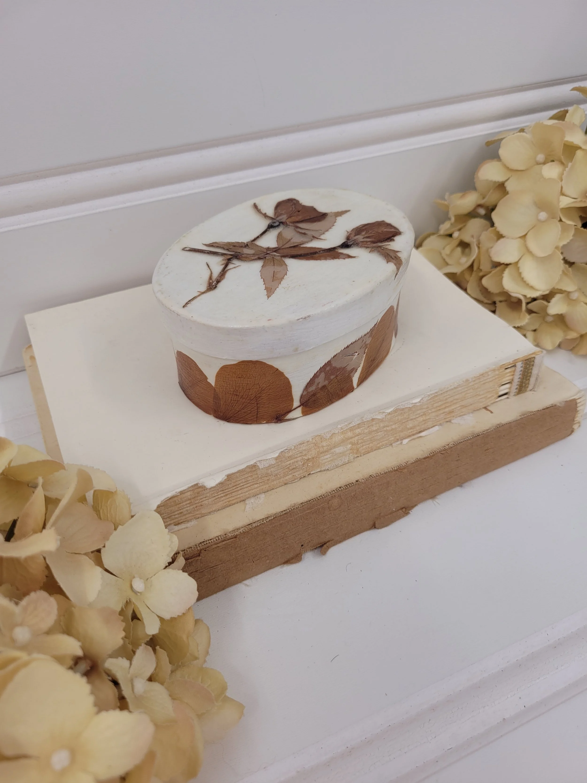 small oval box with dried florals