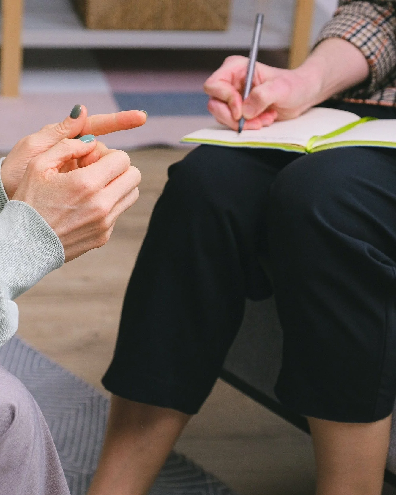 Counselor working to build a positive therapeutic relationship with their new client in a therapy session for anxiety.