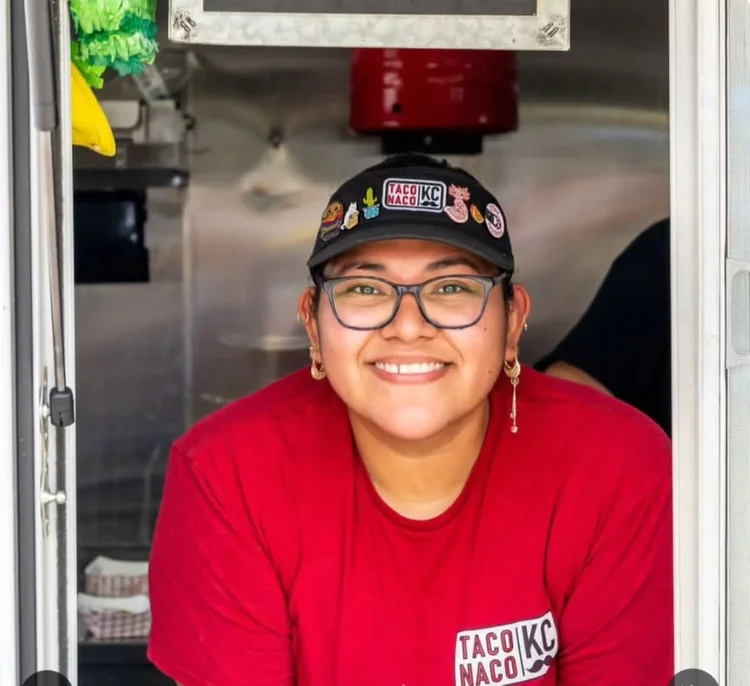 Smiling TACO NACO KC team member at the food truck