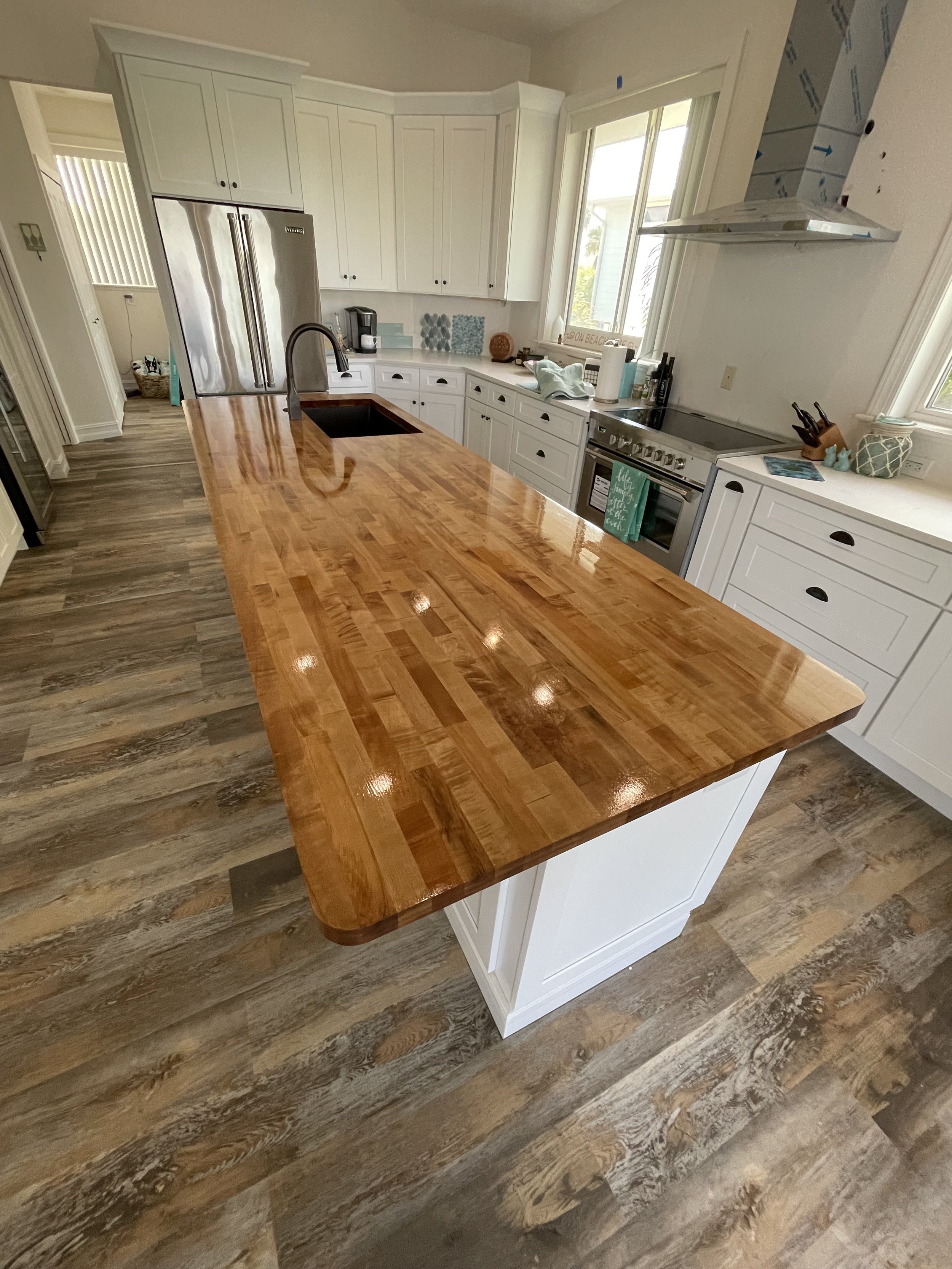 Stained and sealed butcher-block wood countertop in a Sarasota kitchen by Sarasota Residential Painting