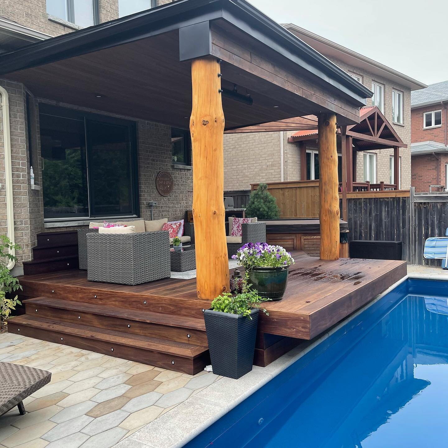 This job was completed last year by our team. It was surprisingly complicated for a job this size. The IPE deck cantilevers over then pool with under mount lighting. We used hand peeled pine logs to support the roof system that was cladded in pine t&