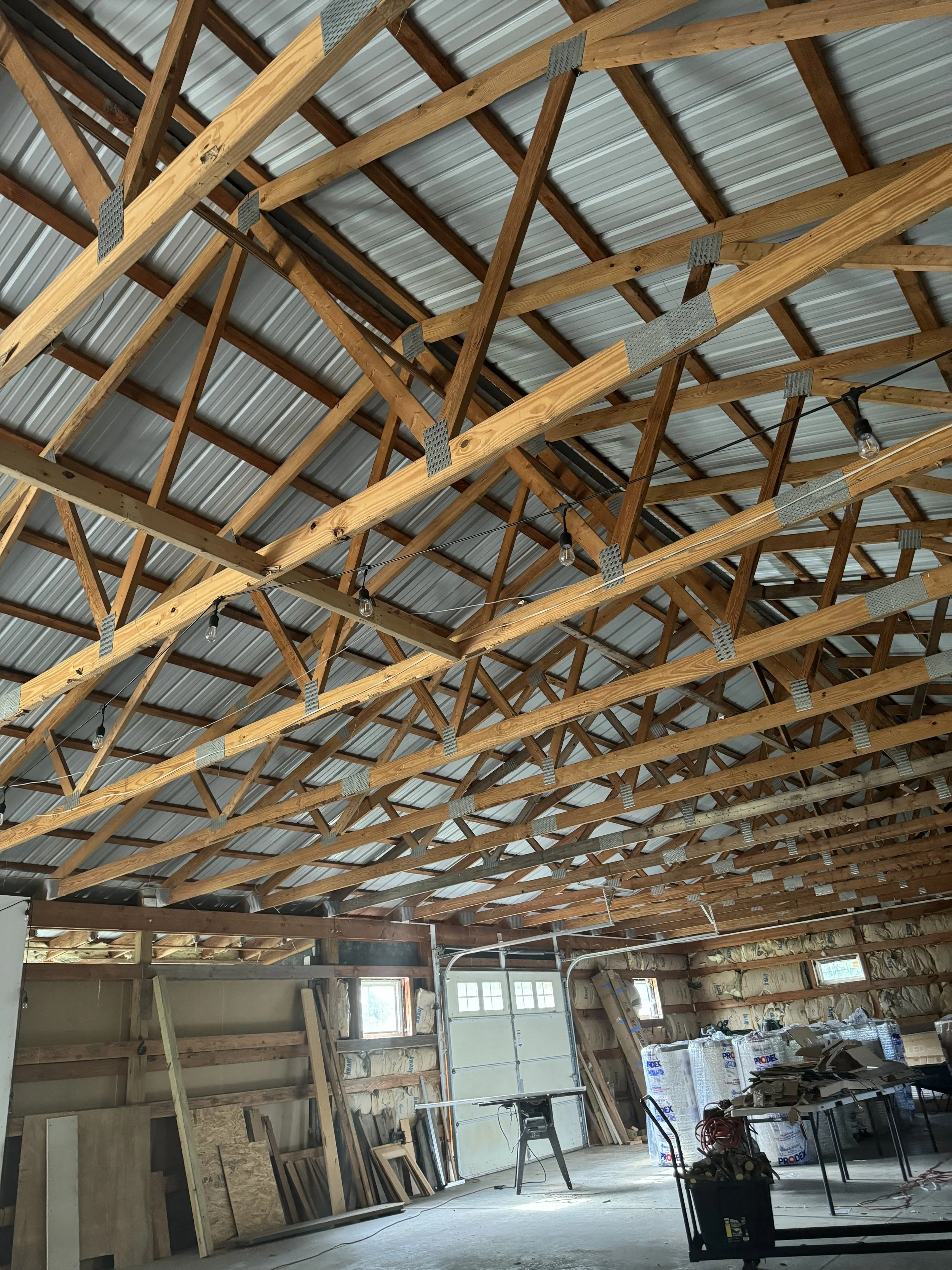 What the barn looked like when we bought it in 2024, AFTER removing the disintegrating insulation