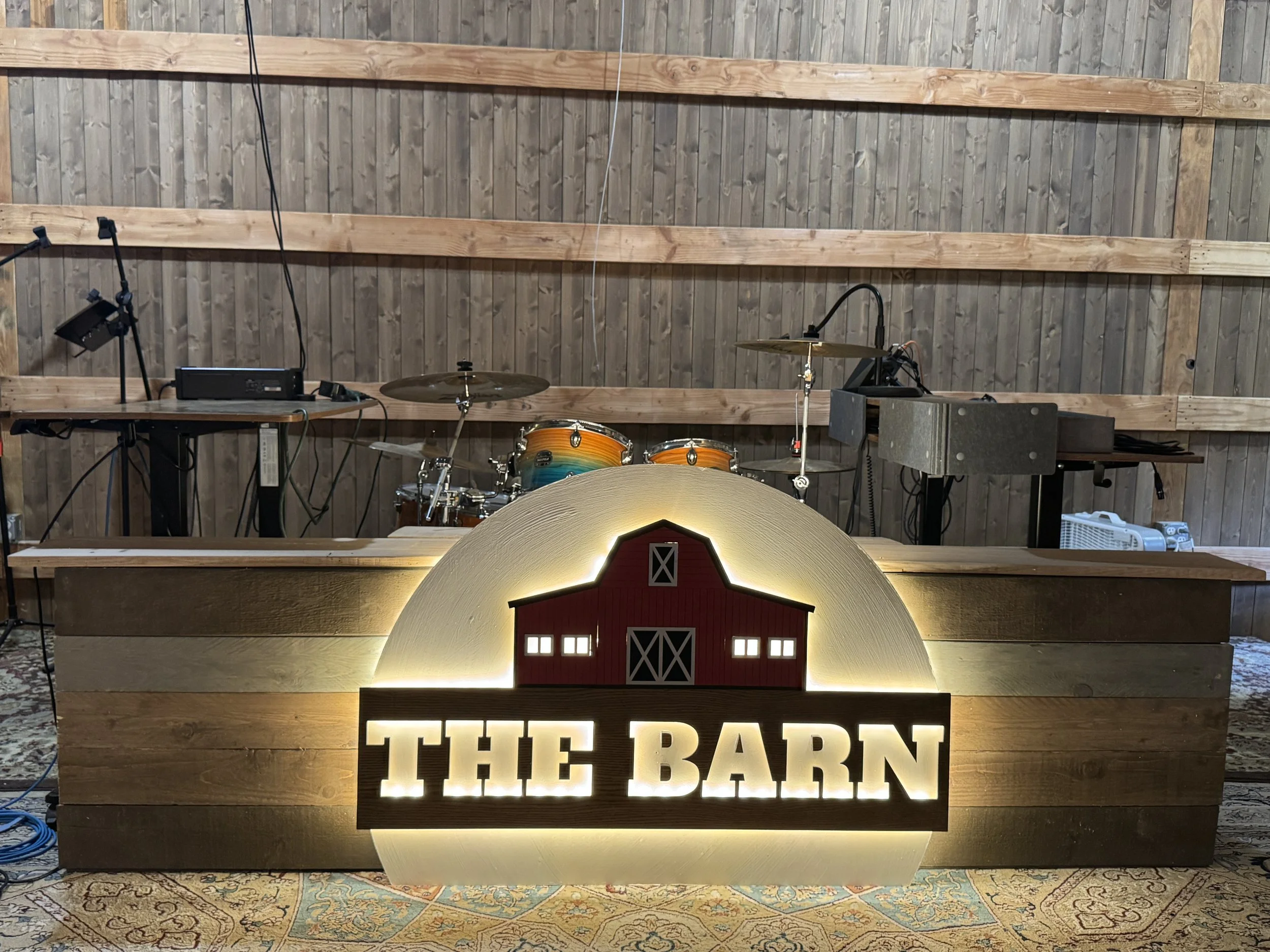 The drum center and sign on stage
