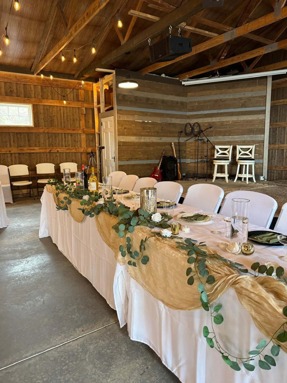 Bride and groom table set up here at front of stage
