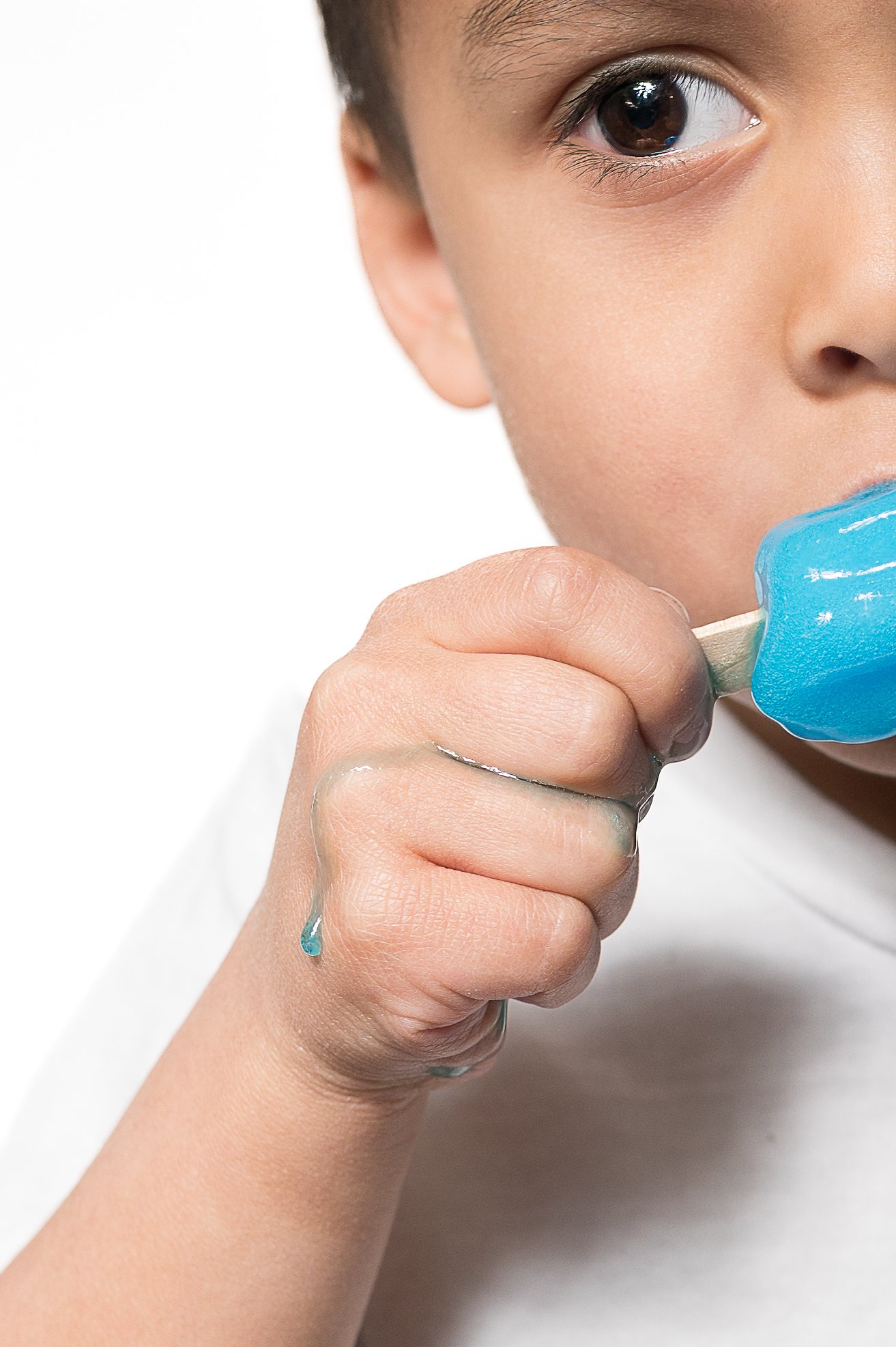 Wellness coach cooking during brand photography session – authentic lifestyle branding in West Michigan.
