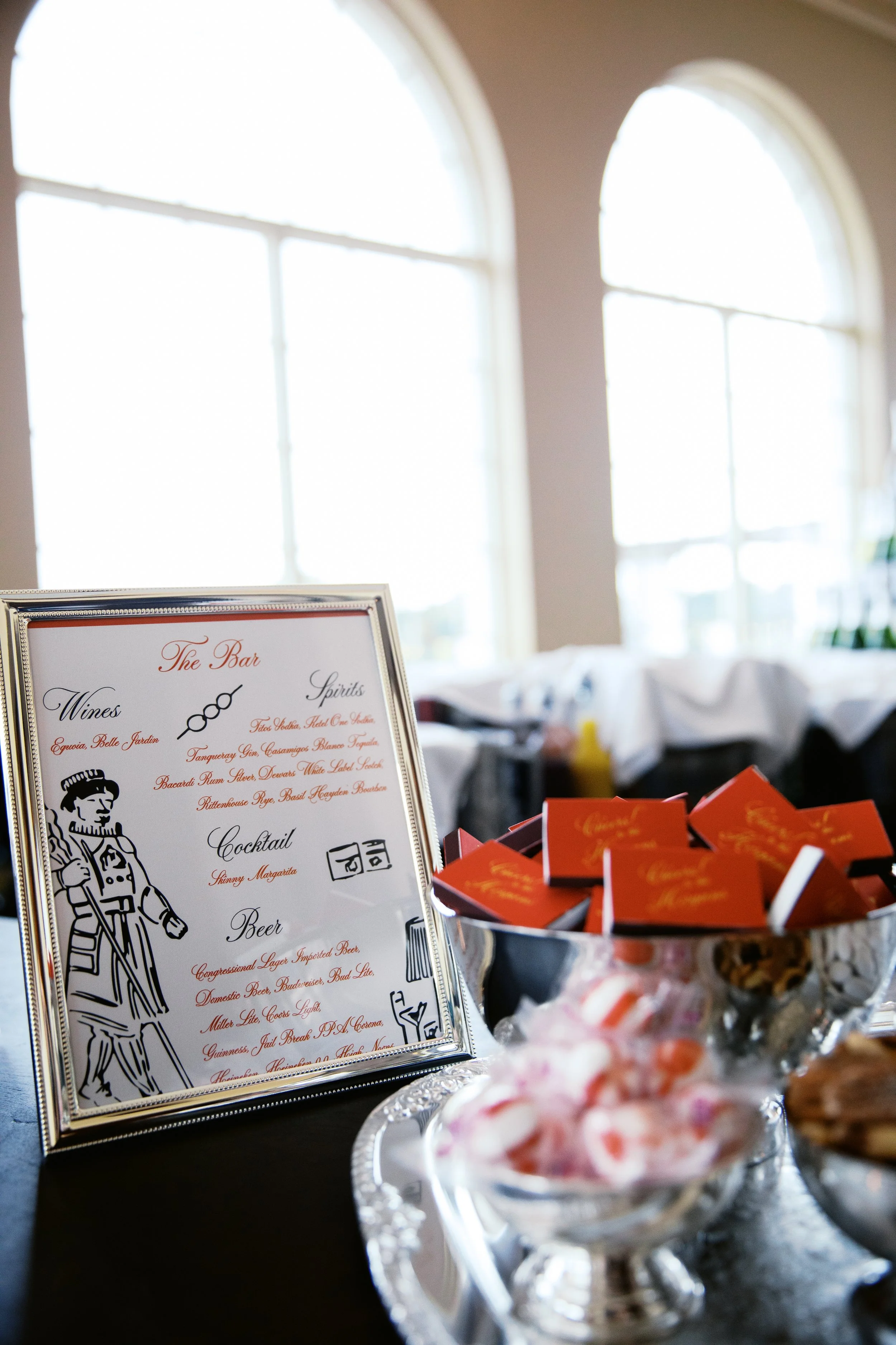 The couples' wedding details featured red match boxes with their names printed. Photograph taken by wedding photographer Sheridan Mangold at Congressional Country Club in Bethesda, MD.