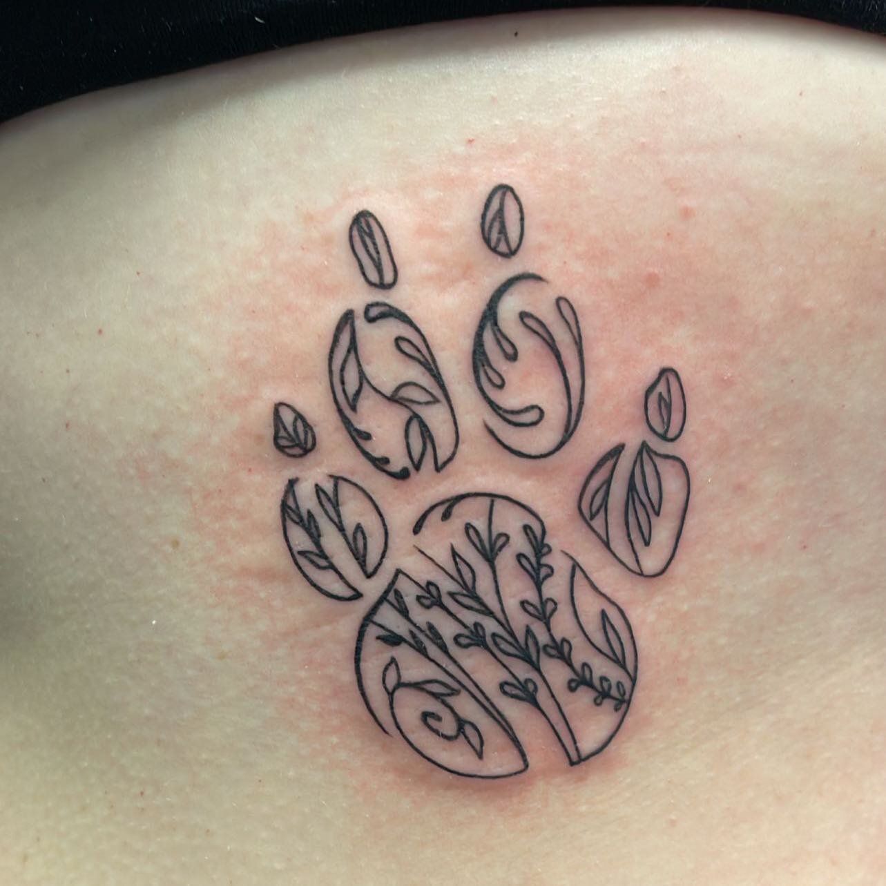 Very cute Dog paw done by @powerstattoos #dogpaw #ribs #lines #blackandgrey #tattoo #artist #flatstattoo