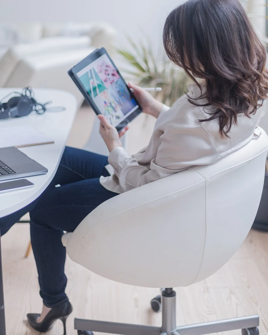 Woman looking at ipad with pictures on it