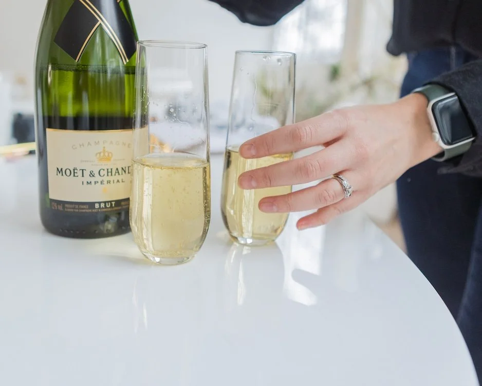 Person pouring glasses of champagne