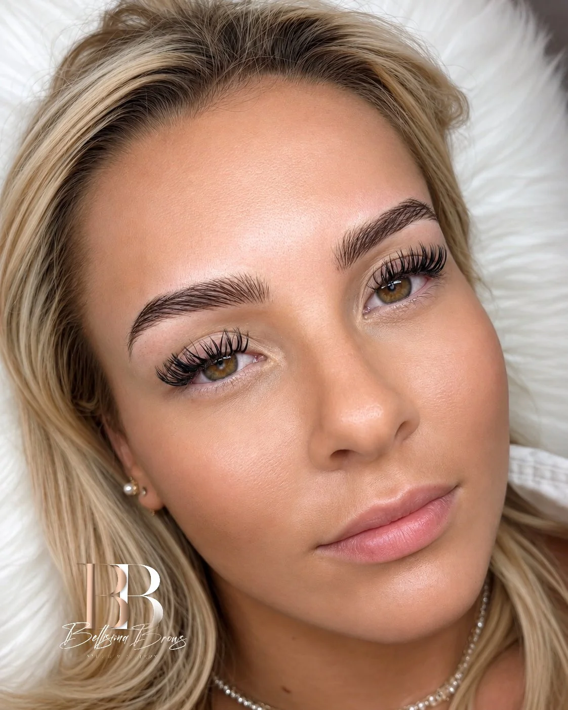 Close-up of a client with Hyper-Realistic Nano Brows and fine natural hairstrokes by Bellisima Brows in Manhattan, NYC.