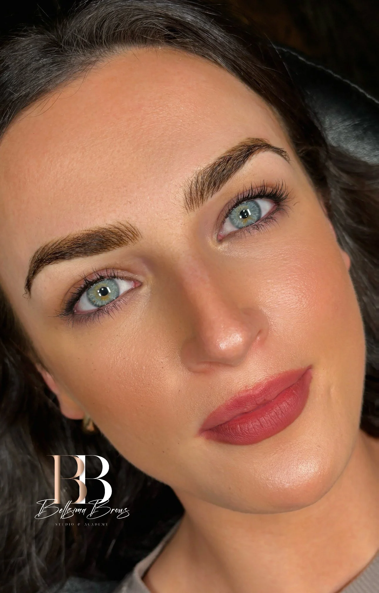 Client showcasing customized Combination Brows with natural hairstrokes and soft powder shading by Bellisima Brows in Manhattan, NYC.