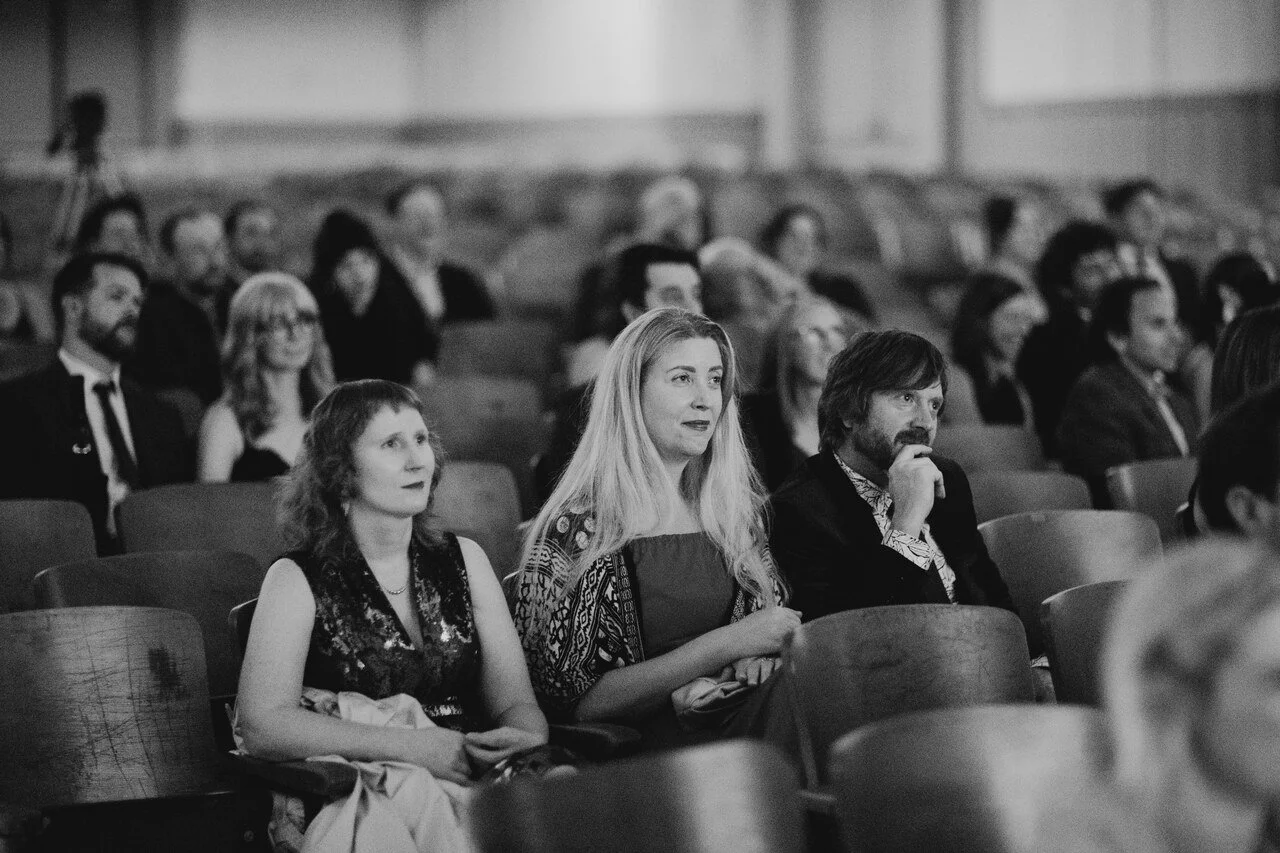 037-wedding-guests-watching-film-ceremony-black-white-bok-auditorium.jpg