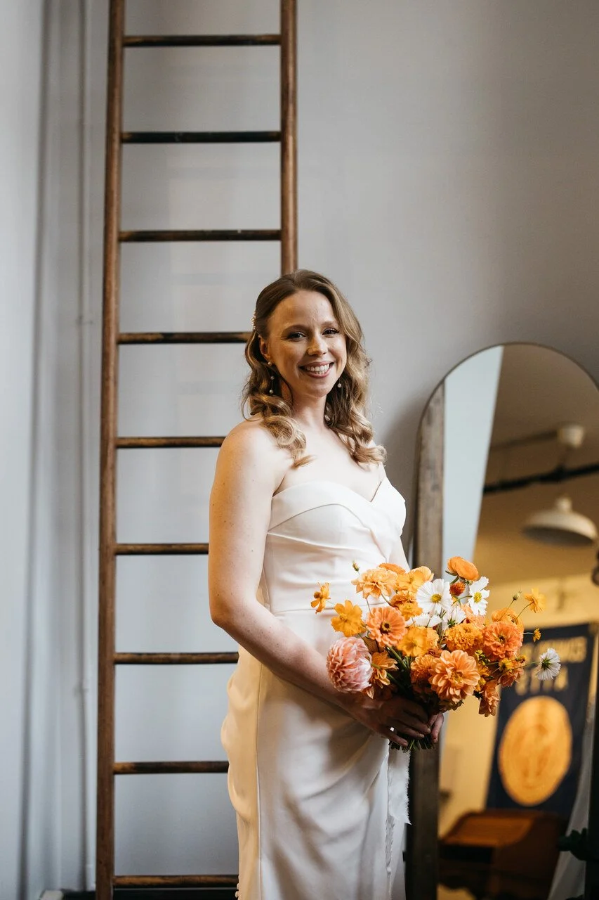 006-bride-portrait-smiling-orange-bouquet-bok-philadelphia.jpg