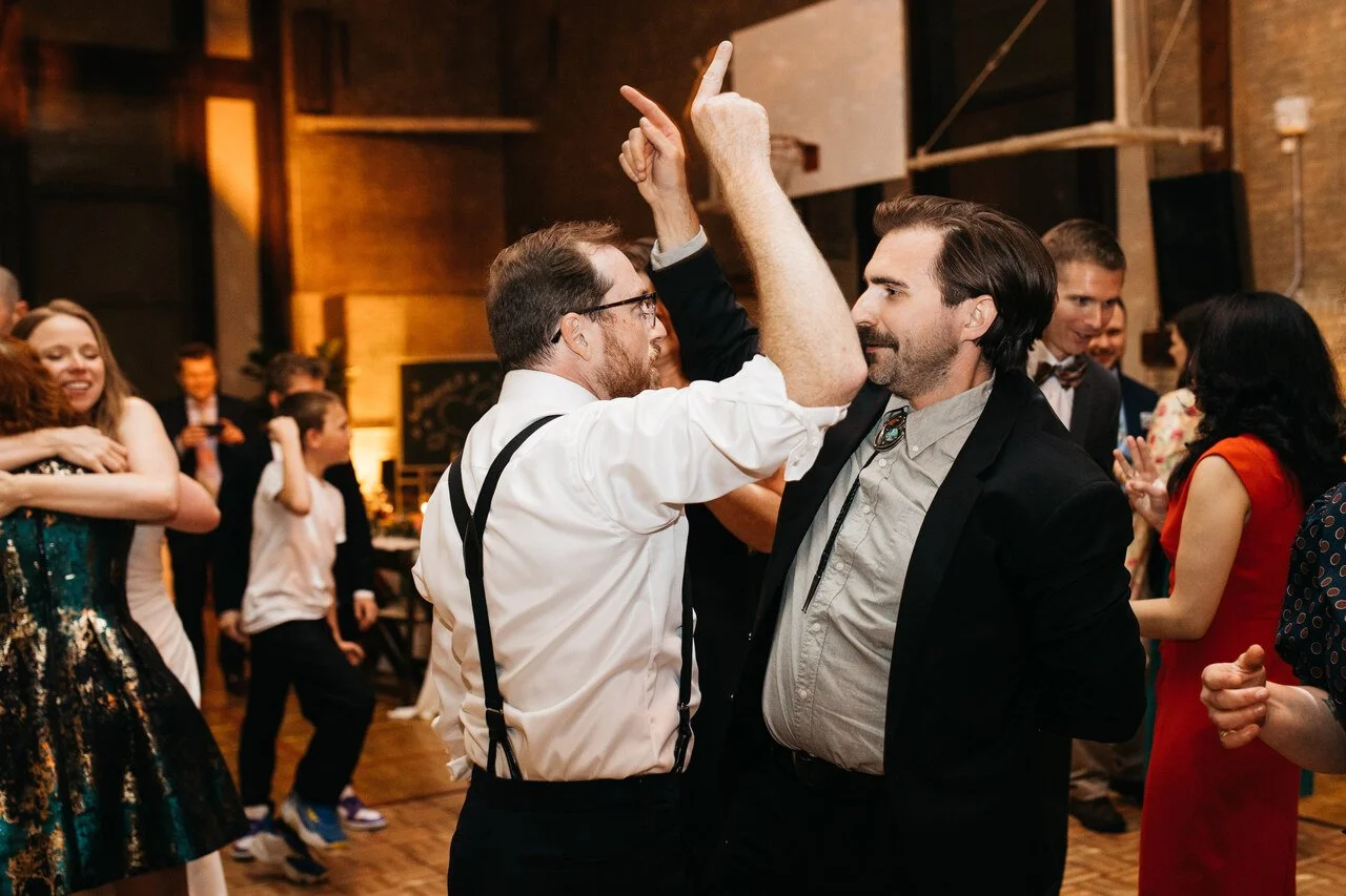 109-guests-dancing-arms-up-late-night-reception-bok-gymnasium.jpg