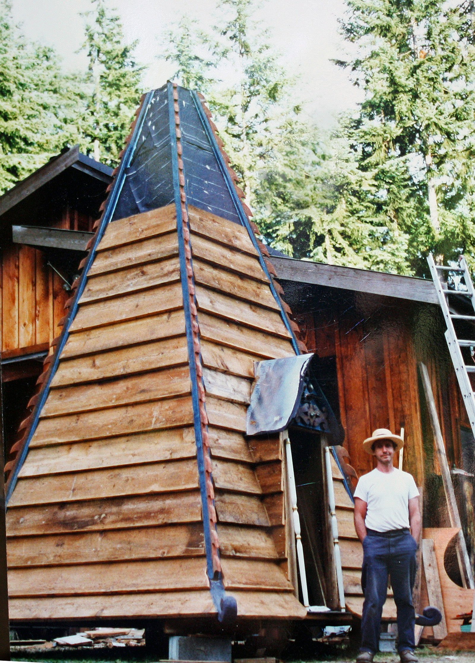 The tower is over 40 feet high. The top 20 foot section was build on the ground and lifted on with a crane.
