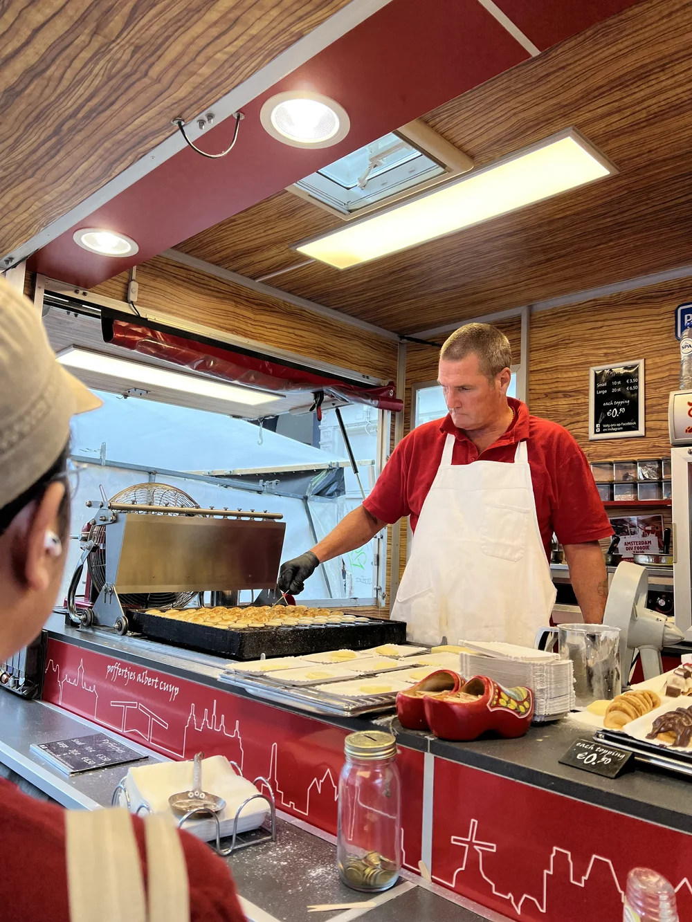  The guy who runs the pofferjes stand making our pofferjes at Cuypmarkt! 