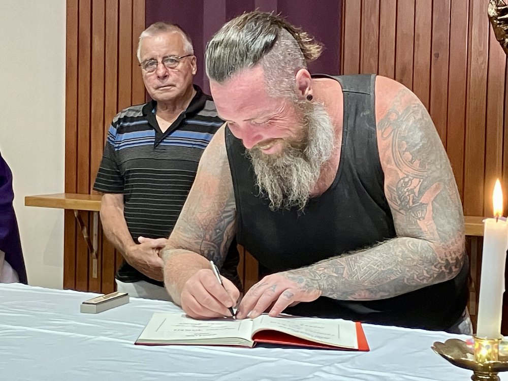 Luke signing the Book of the Elect (Copy) (Copy) (Copy)