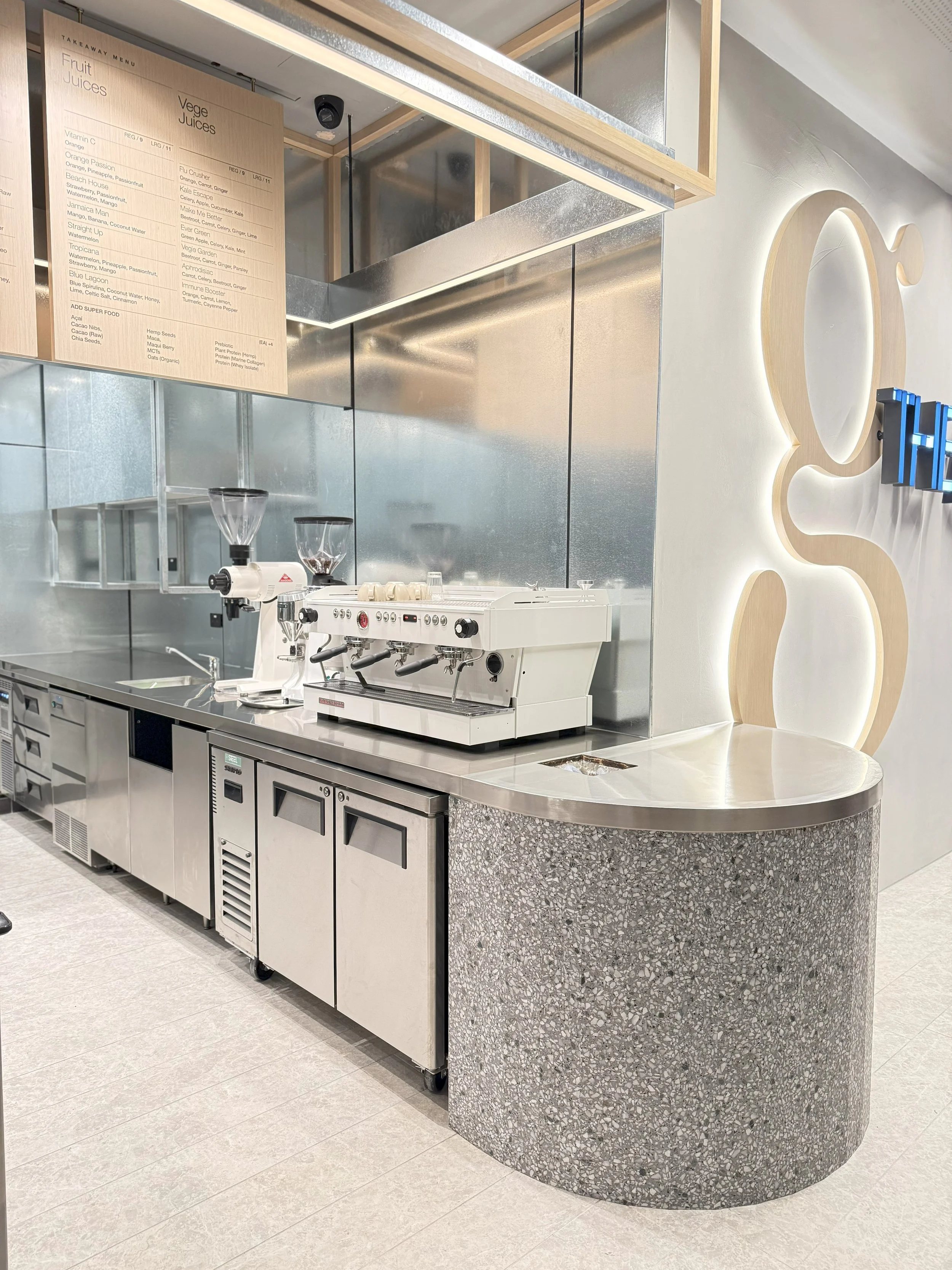 Curved terrazzo-style café counter at The Gardens, Sydney