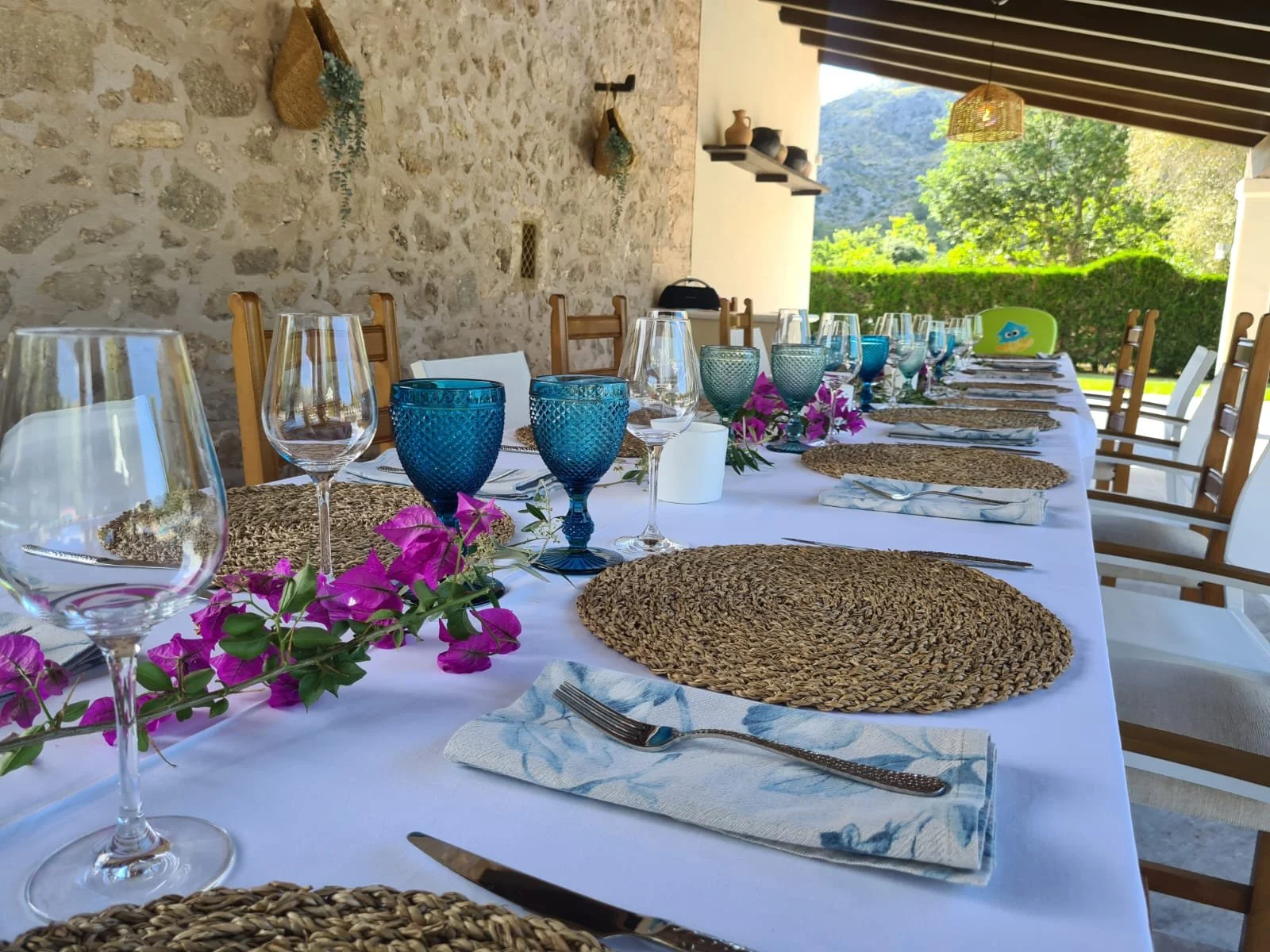 Bluelime Bespoke sets the table with flowers and linen napkins ready for your professional private chef private dining in your Mallorca private villa