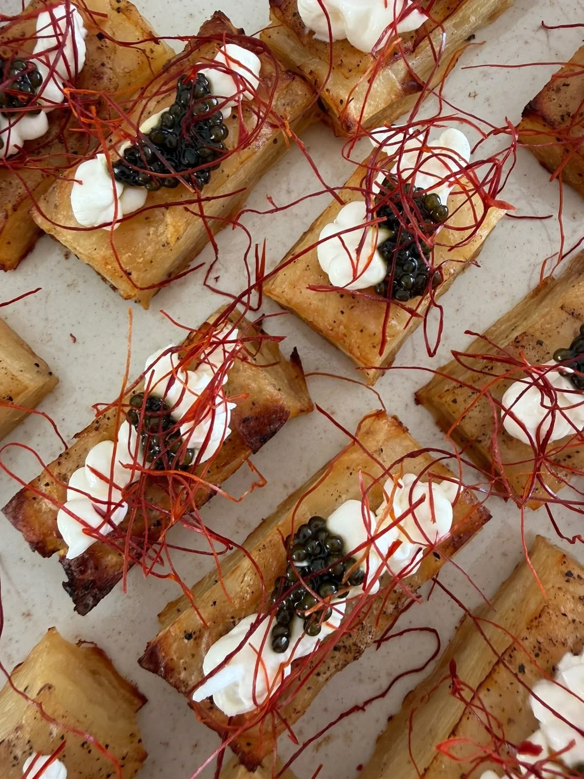 Bite-sized canapés topped with caviar, served at a celebration in Mallorca