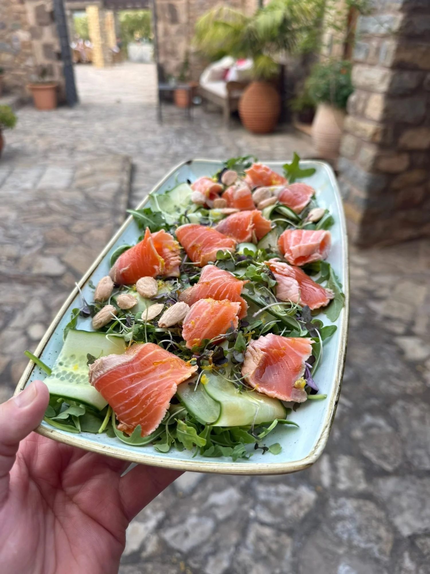 Smoked salmon salad with fresh leaves, served at a private villa lunch in Mallorca