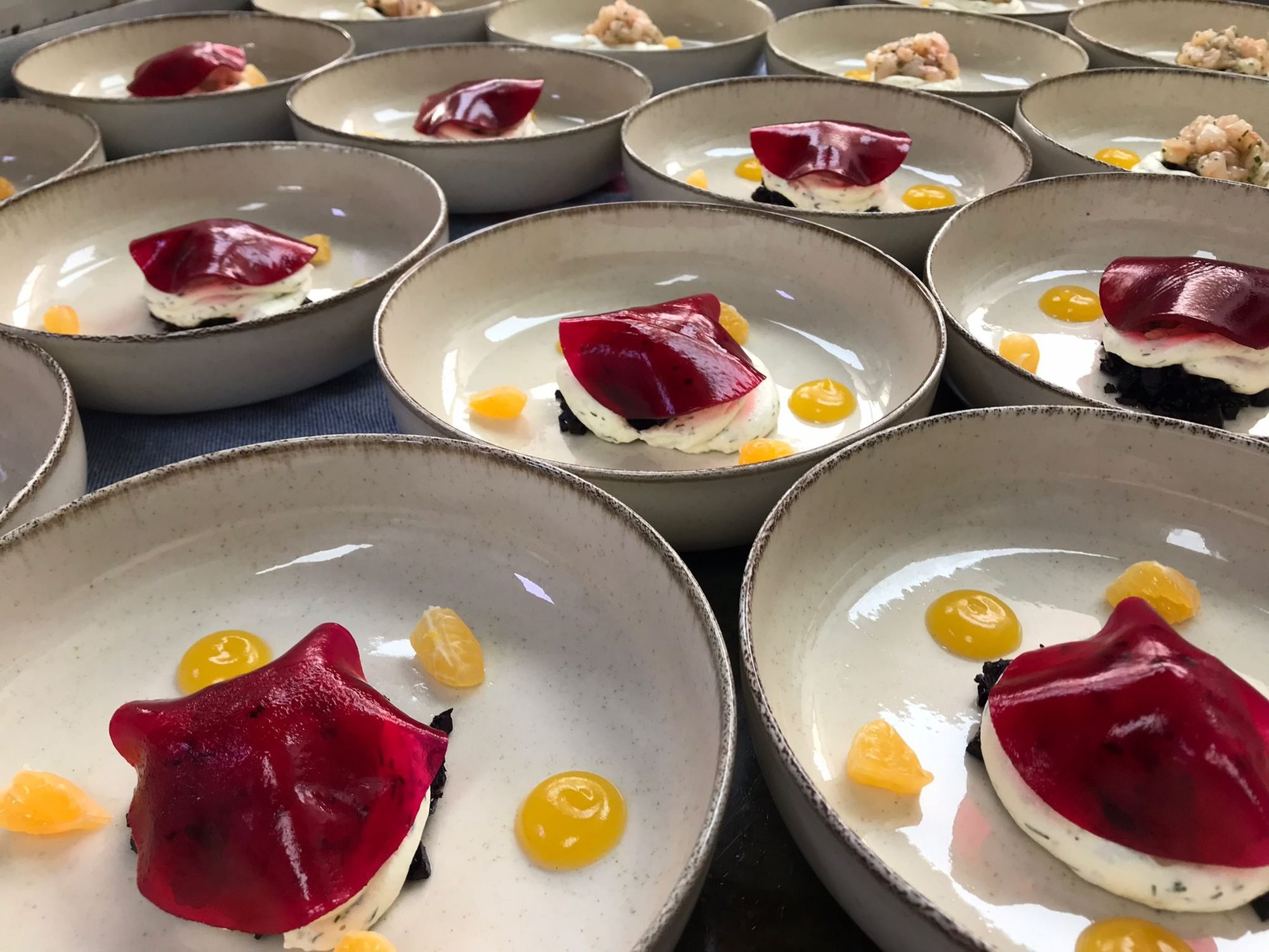 Plated beetroot starters lined up ready for service at a Bluelime Bespoke private dinner in Mallorca