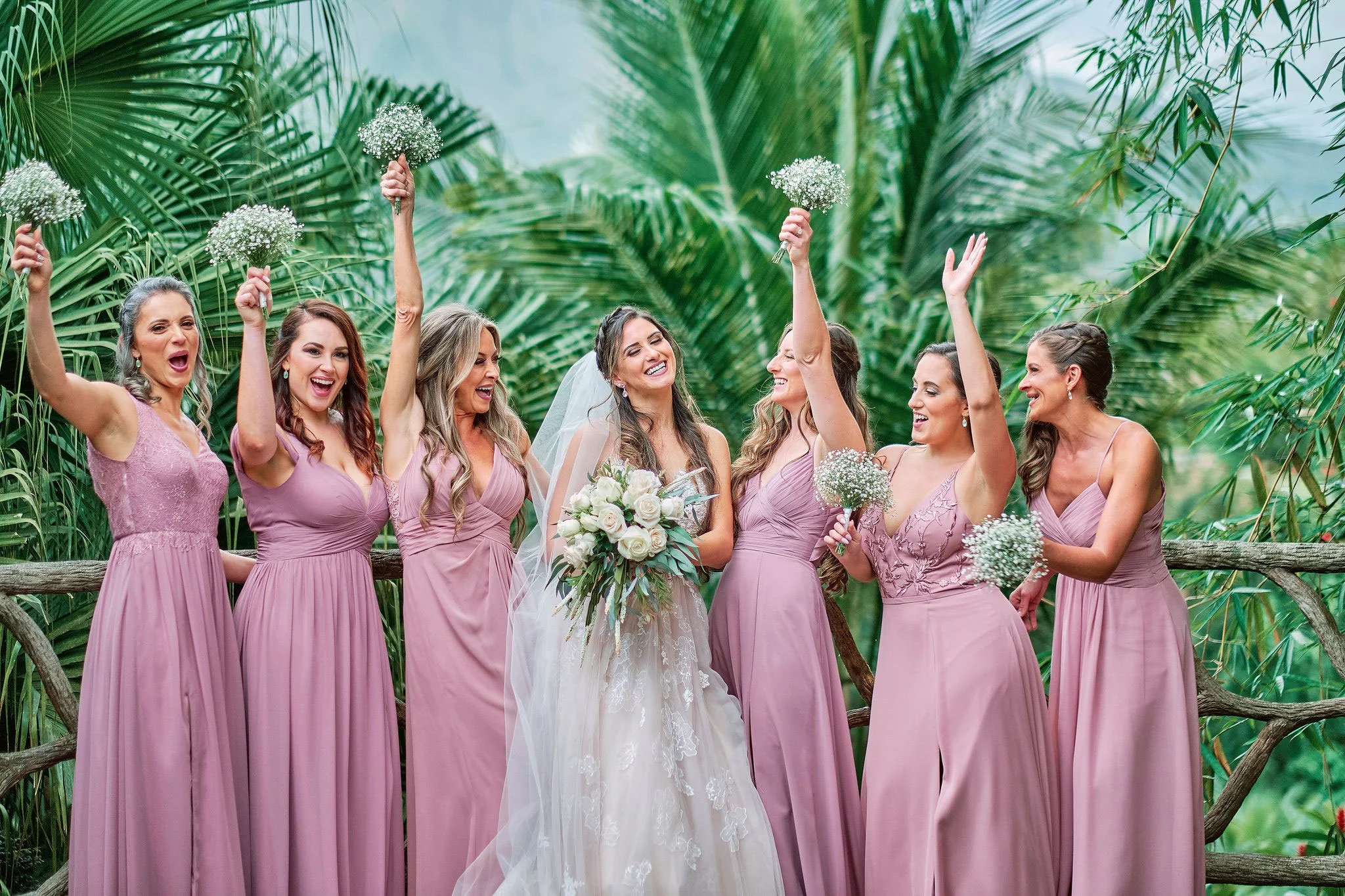 Exotic lilac rainforest bridal party with vibrant tropical flowers
