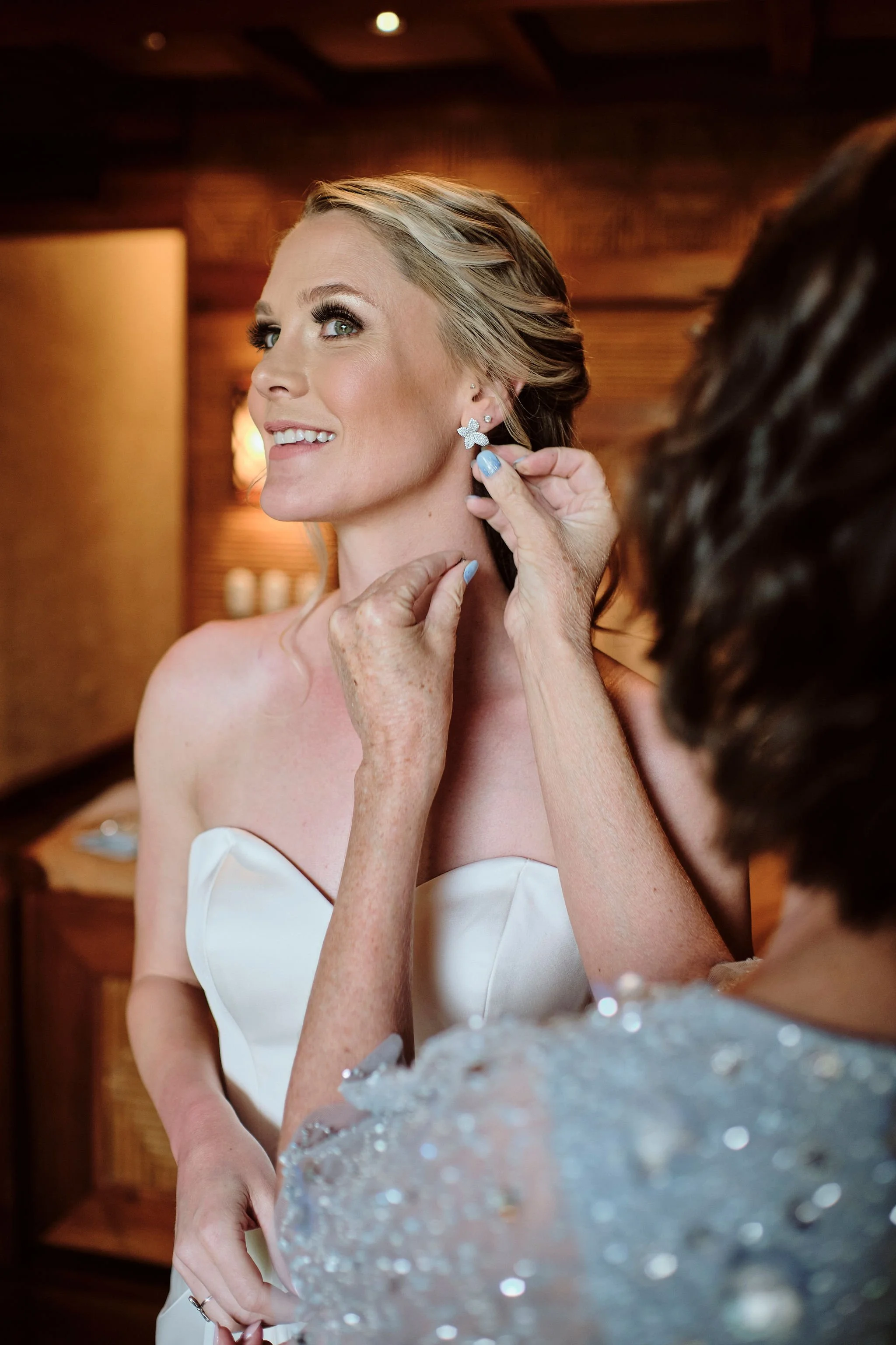 Bride getting ready for her timeless adventure-filled wedding and lush greenery all around.