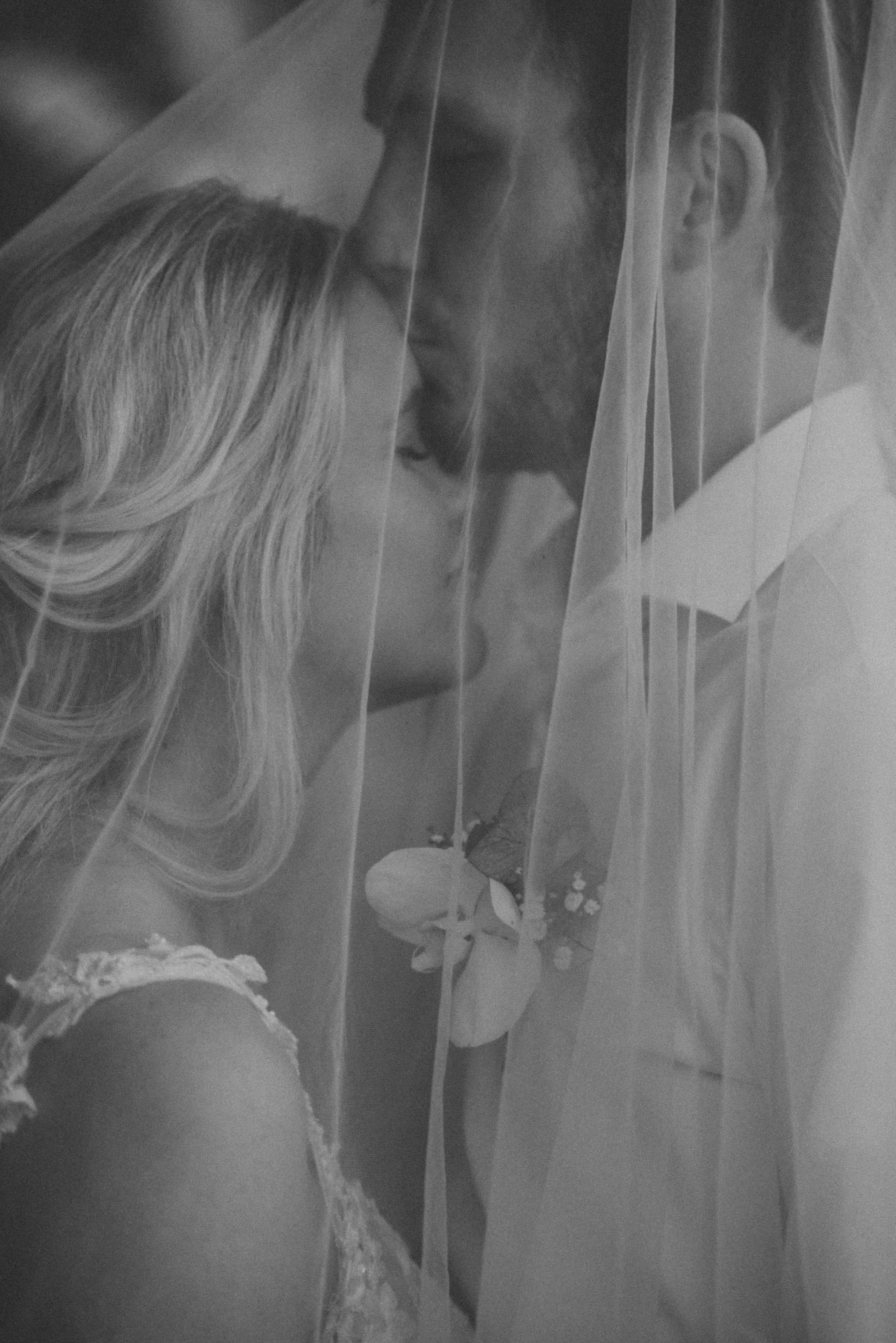 A tropical, intimate wedding elopement moment between bride and groom