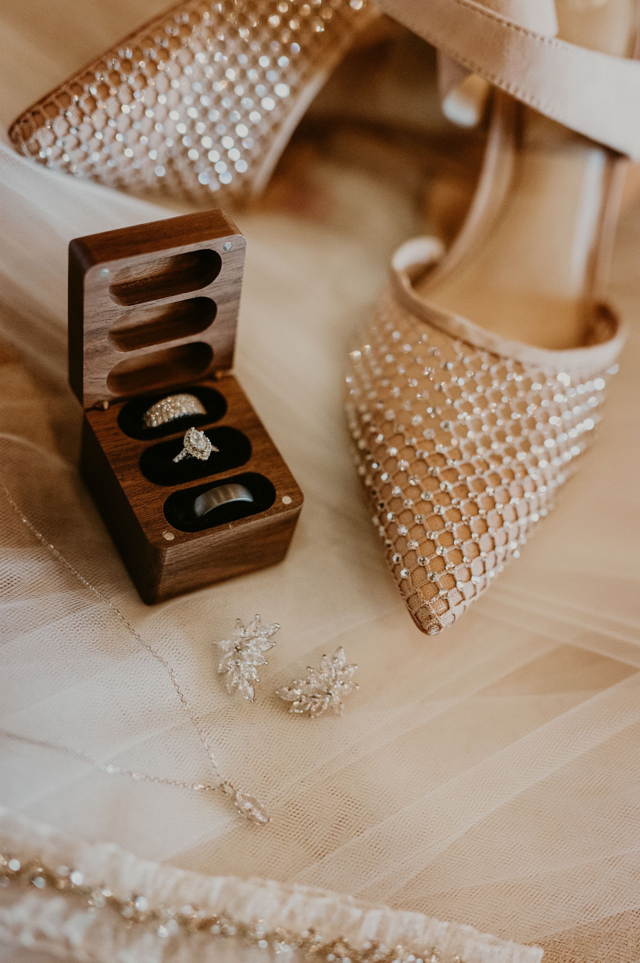 A classic elegant details of wedding rings and shoes