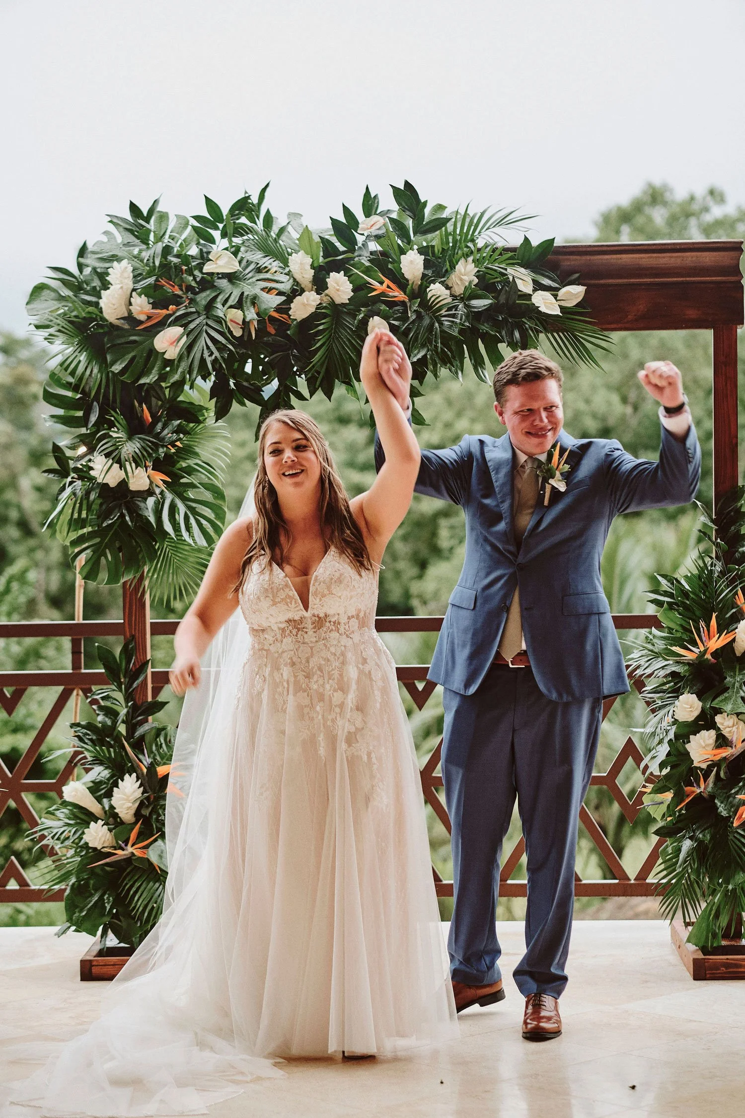 Tropical, colorful wedding with Arenal Volcano towering over a vibrant ceremony.