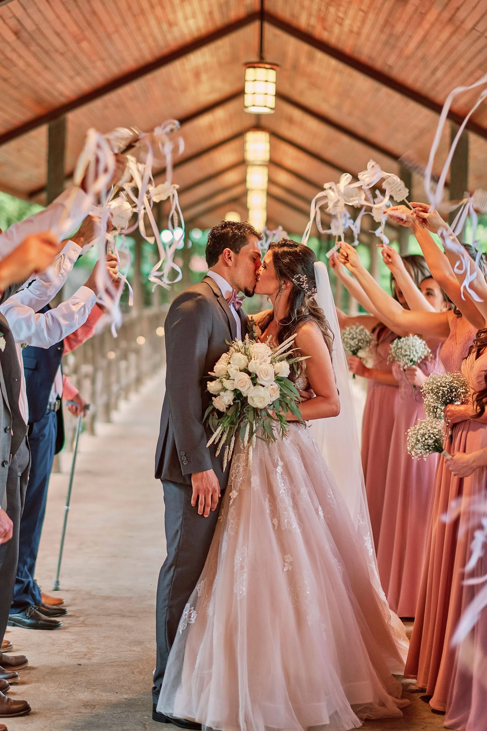 Romantic kiss shared by the couple with their party guests celebrating