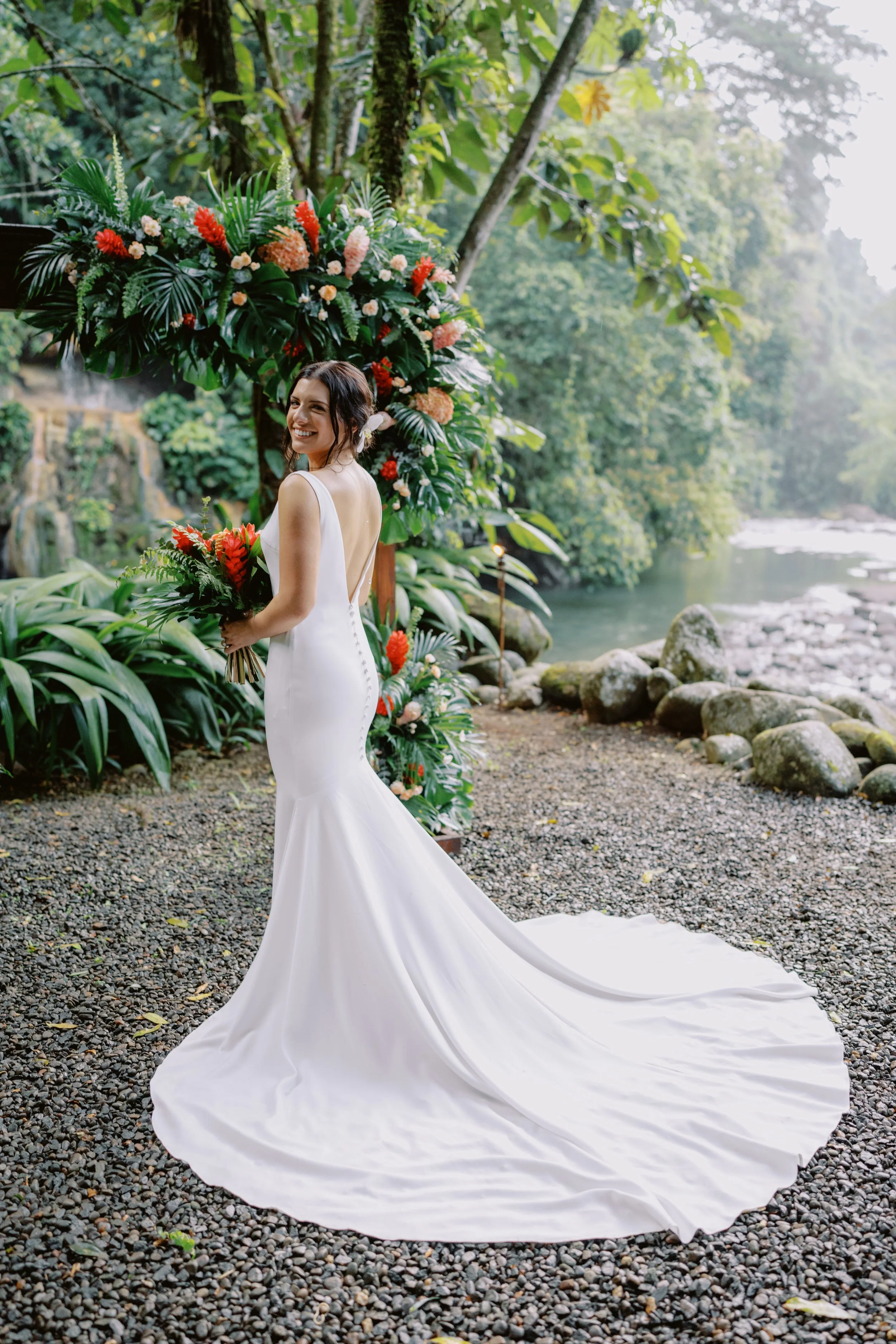 Stunning bride by Arenal Volcano with breathtaking views of the river.