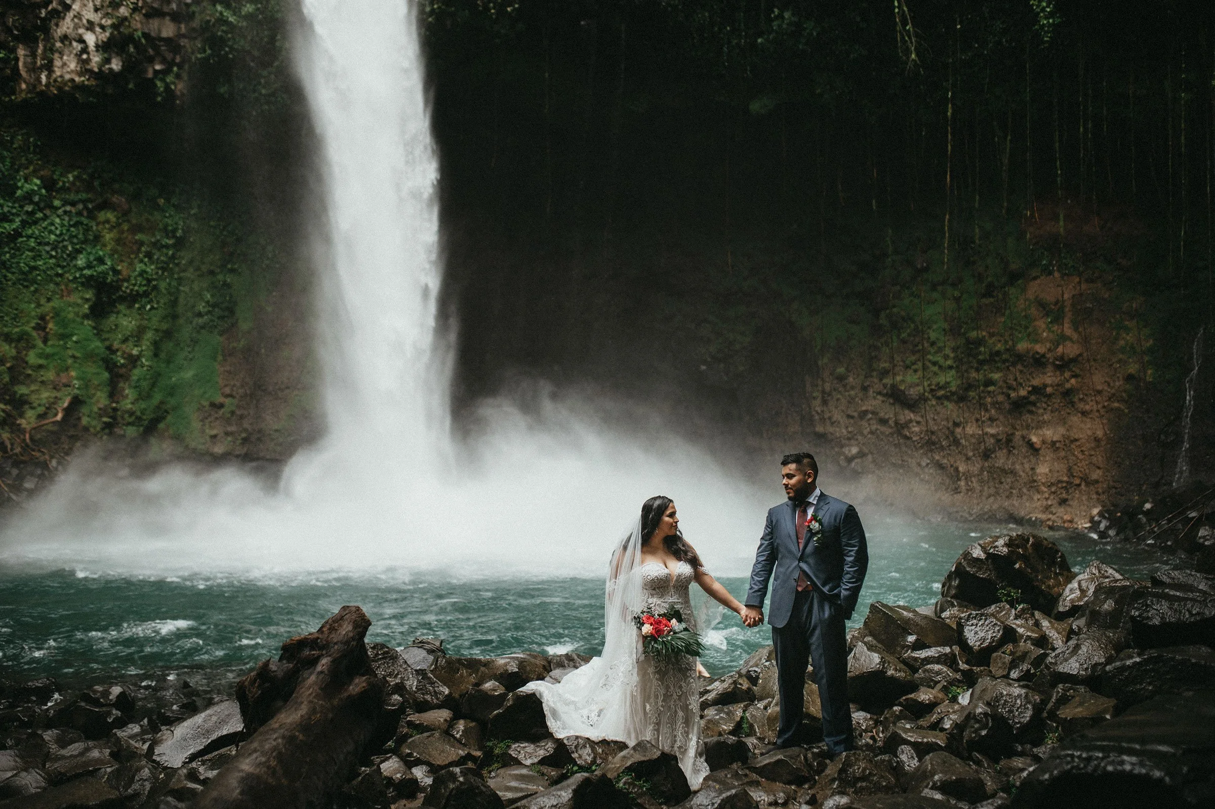 Tropical rainforest elopement ceremony waterfall in Costa Rica.