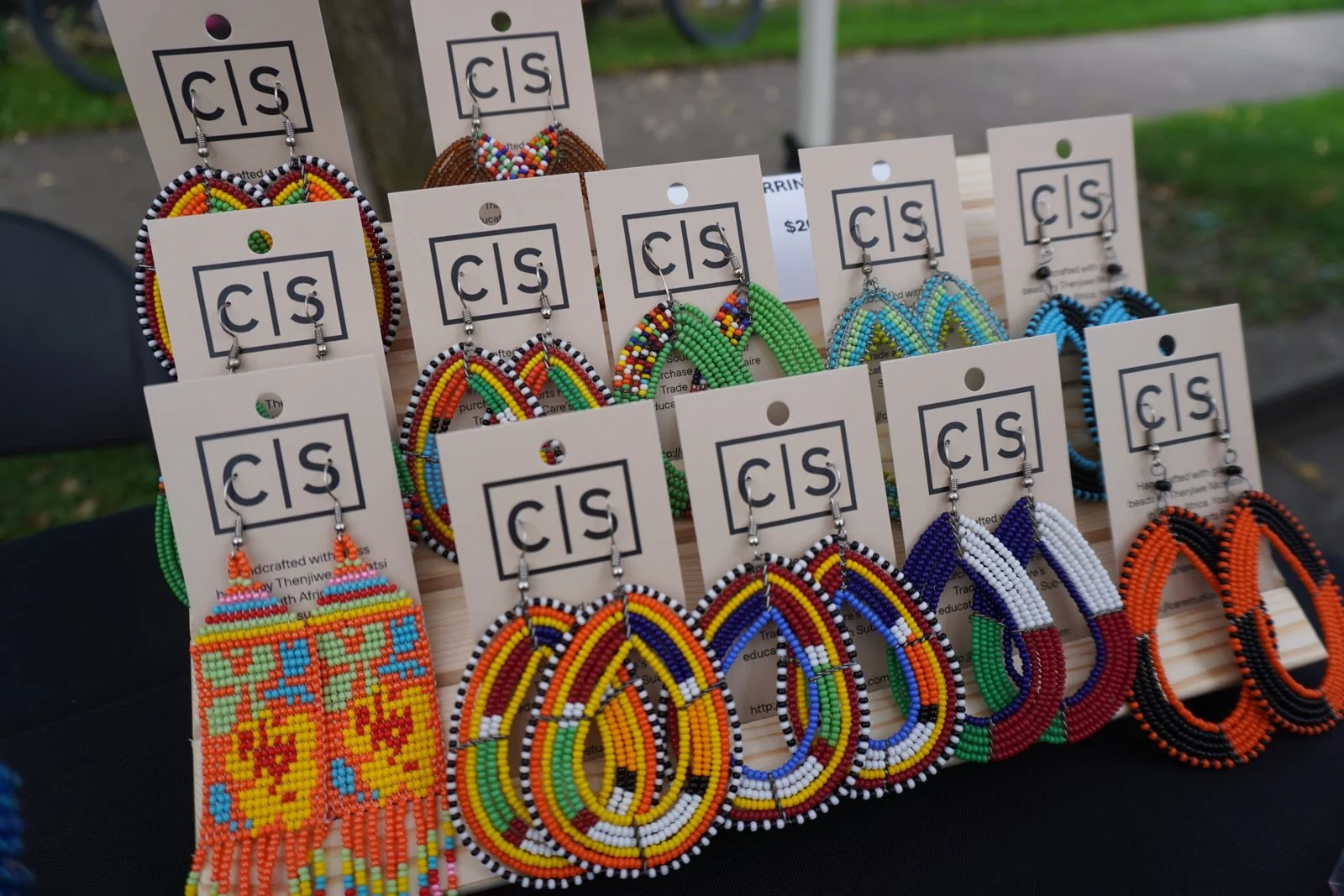 Beaded hoop earrings on Care Studios display cards