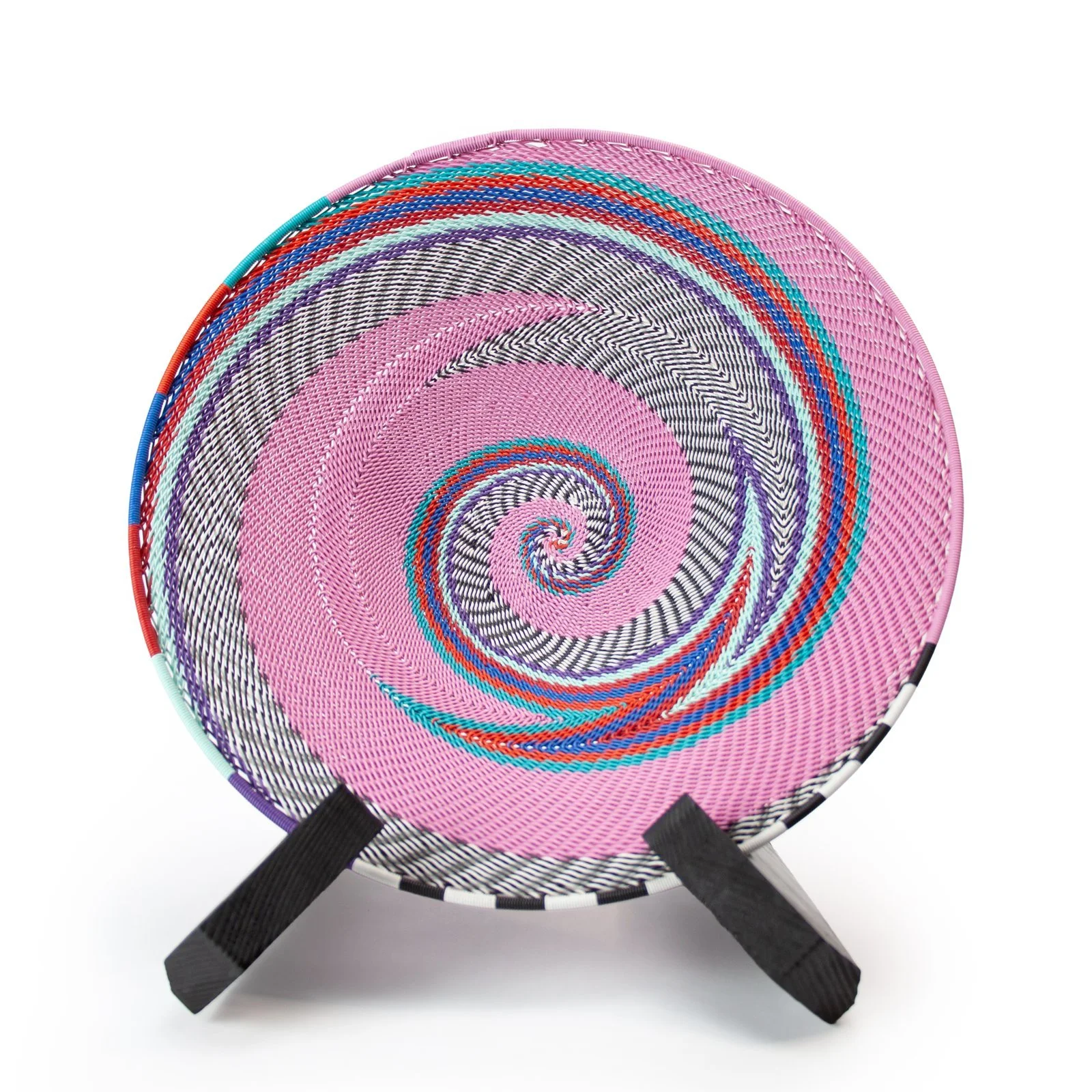 Pink spiral wire basket on a stand