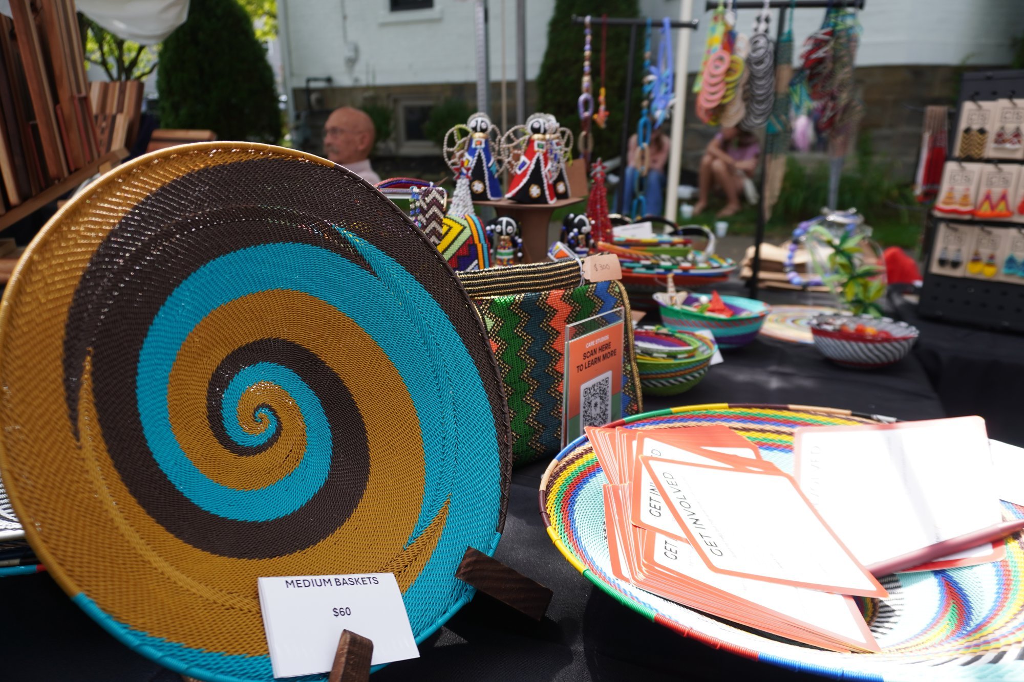 Care Studios table display with a spiral wire basket in front